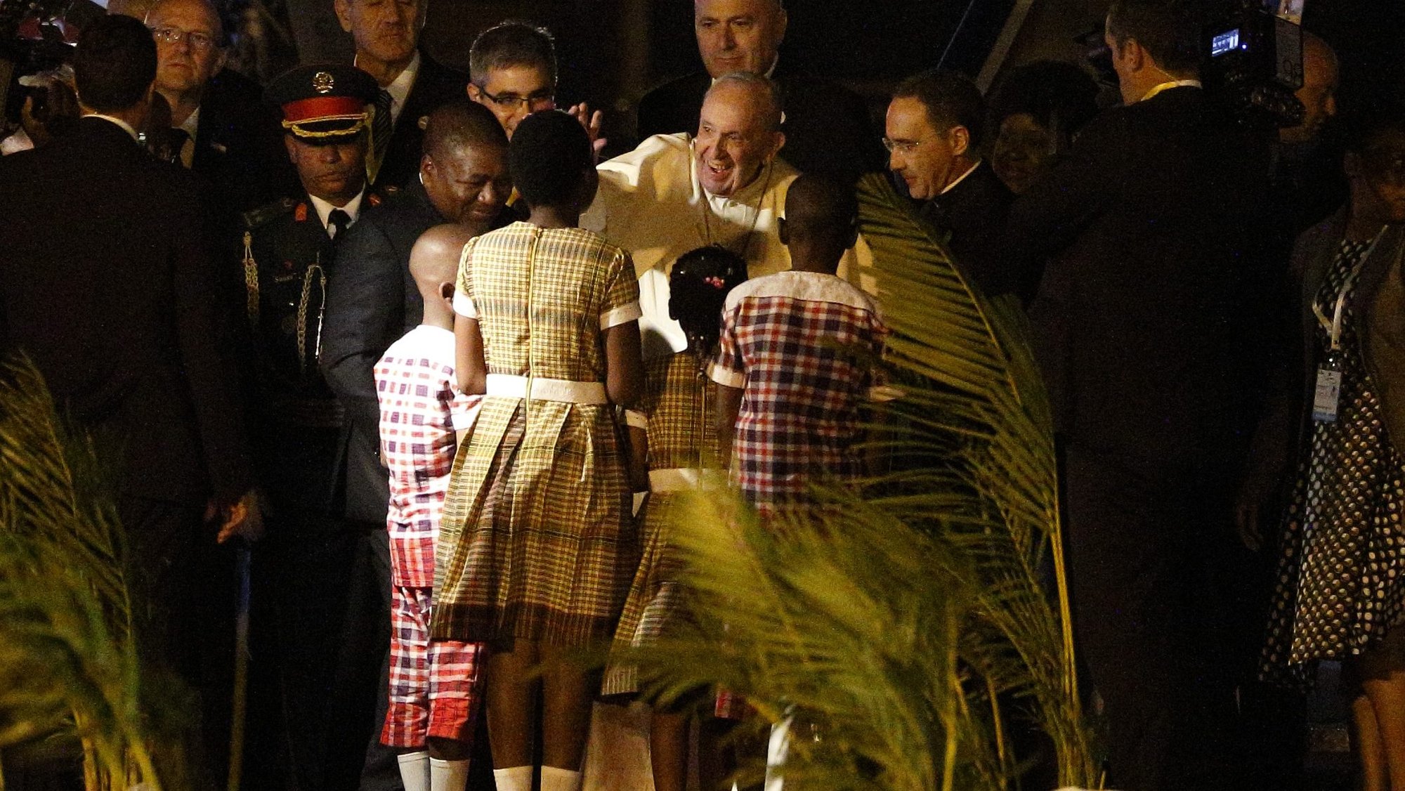 Pope Francis is pictured with Mozambican President Filipe Nyusi as he greets children at the airport in Maputo, Mozambique, Sept. 4, 2019. Hundreds of thousands of Mozambicans remain displaced following late-June attacks. (CNS photo/Paul Haring)