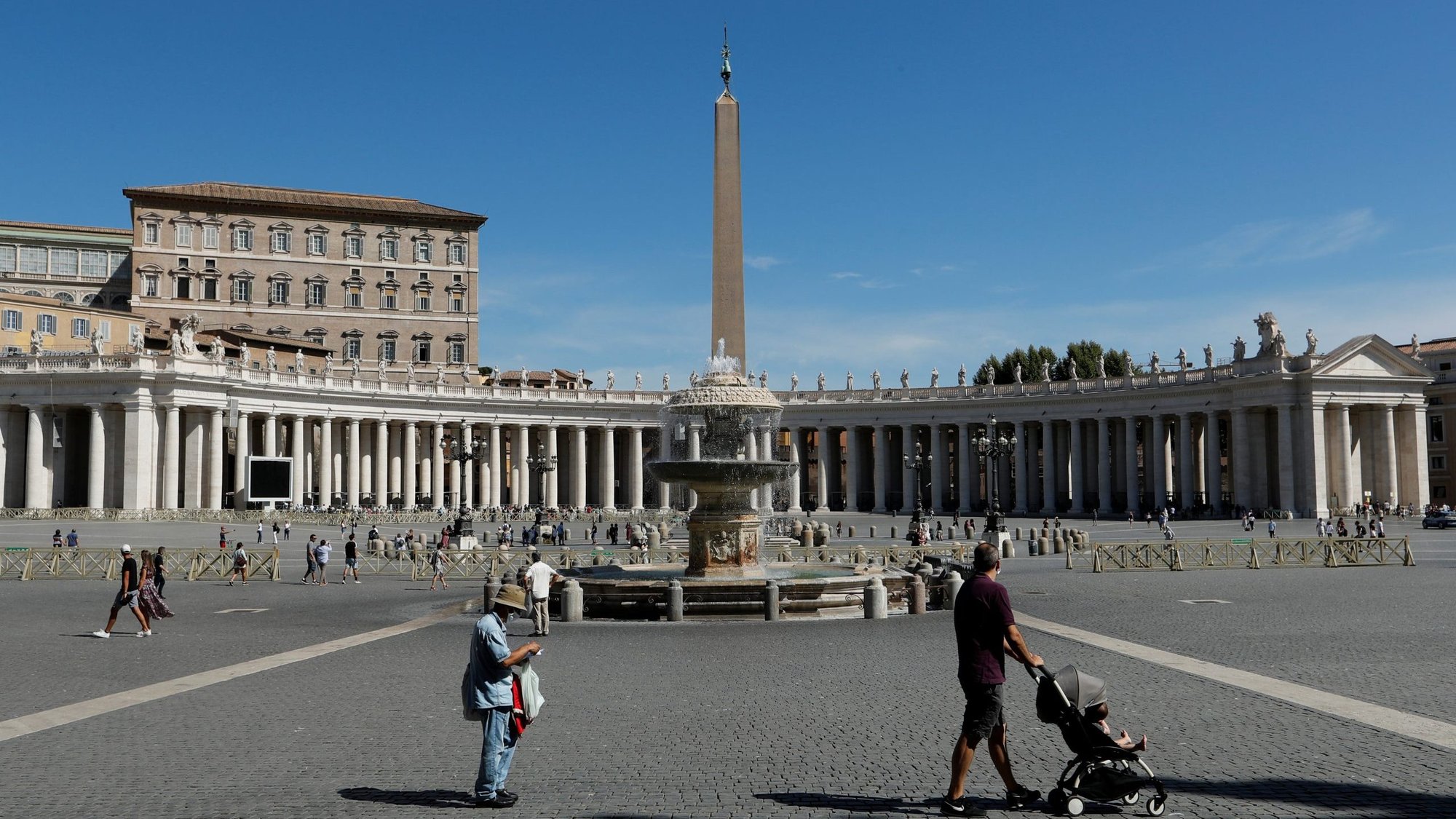 People walk in St. Peter's Square as Pope Francis gives his weekly general audience livestreamed from the library of the Apostolic Palace at the Vatican Aug. 5, 2020. (CNS photo/Remo Casilli, Reuters)