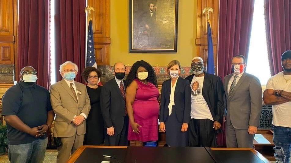 Iowa Gov. Kim Reynolds, center, appears with Betty Andrews, left, of the Iowa-Nebraska NAACP, and other supporters of an executive order that restored voting rights to individuals who have completed sentences for felony convictions Aug. 5, 2020. (CNS photo/CNS photo/courtesy The Catholic Messenger)