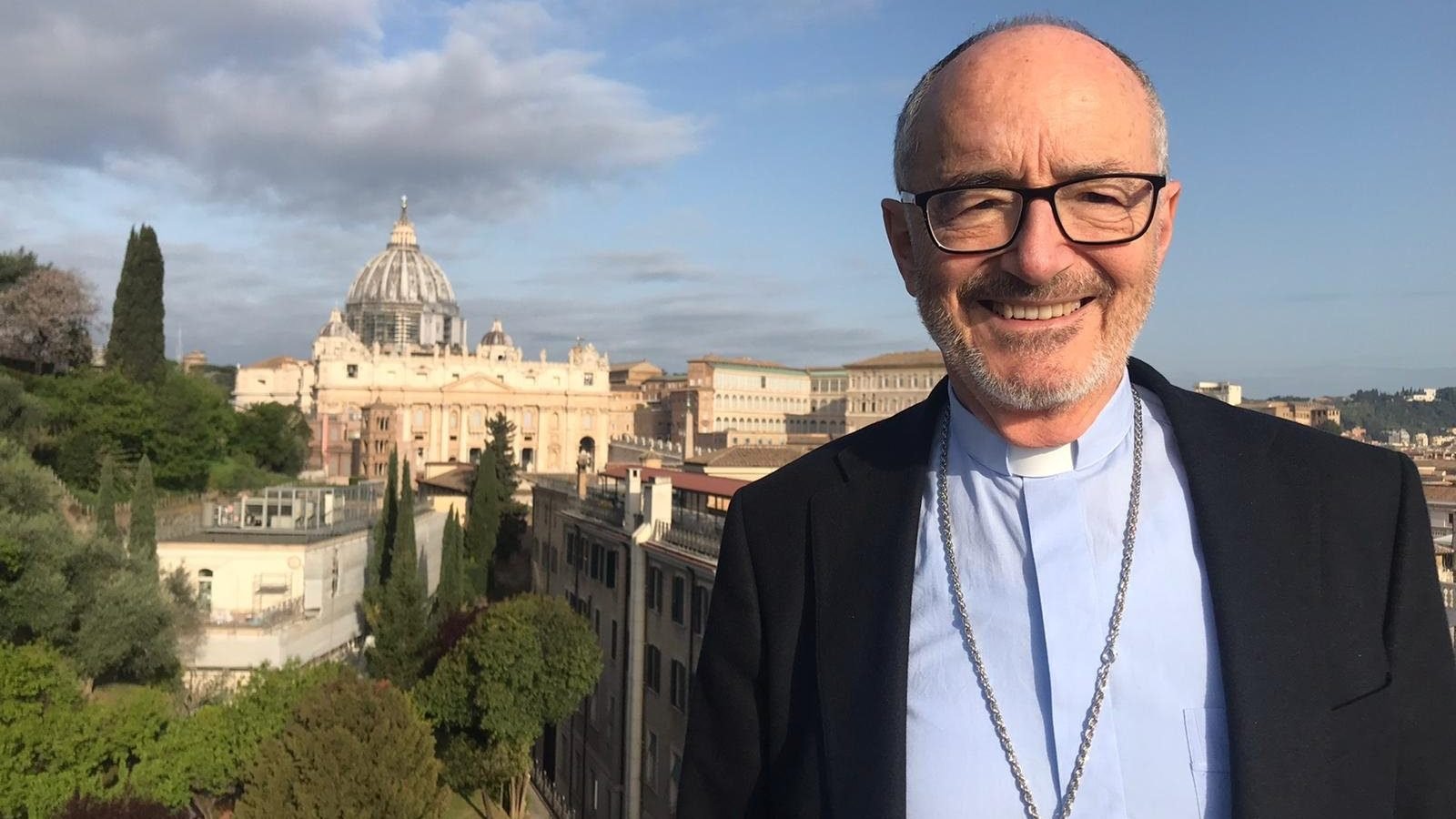 Cardinal Michael Czerny, undersecretary for the Vatican's Migrants and Refugees Section, stands on the terrace of the Jesuit residence in Rome where he lives and, during the coronavirus lockdown, works. (CNS photo/courtesy Cardinal Czerny)