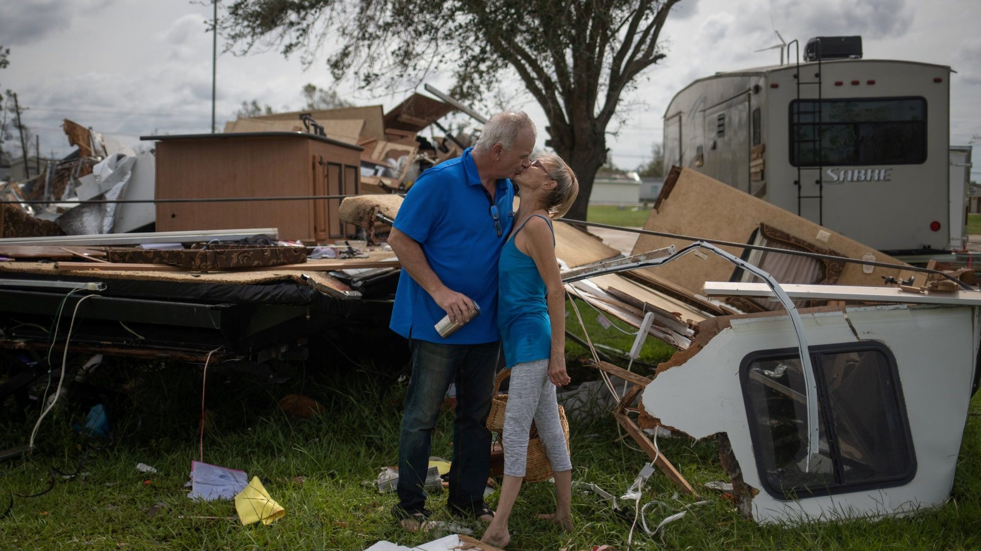 A couple in Sulphur, La., kiss after surviving Hurricane Laura Aug. 27, 2020. (CNS photo/Adrees Latif, Reuters)