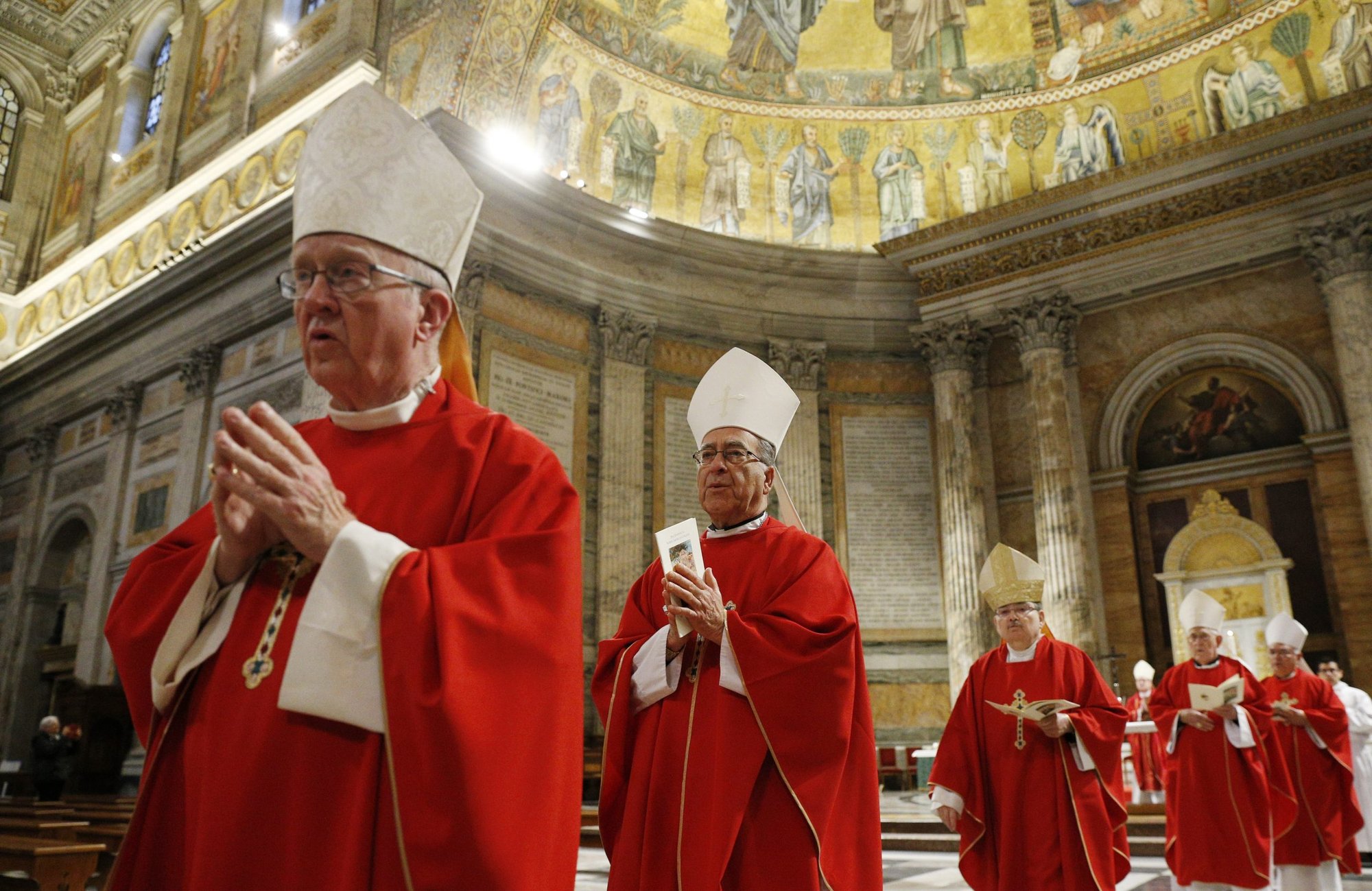 Bishop Kevin W. Vann of Orange, Calif., and Bishop Myron J. Cotta of Stockton, Calif., walk in procession with bishops from California, Hawaii and Nevada after concelebrating Mass at the Basilica of St. Paul Outside the Walls while making their "ad limina" visits in Rome Jan. 31, 2020. (CNS photo/Paul Haring)