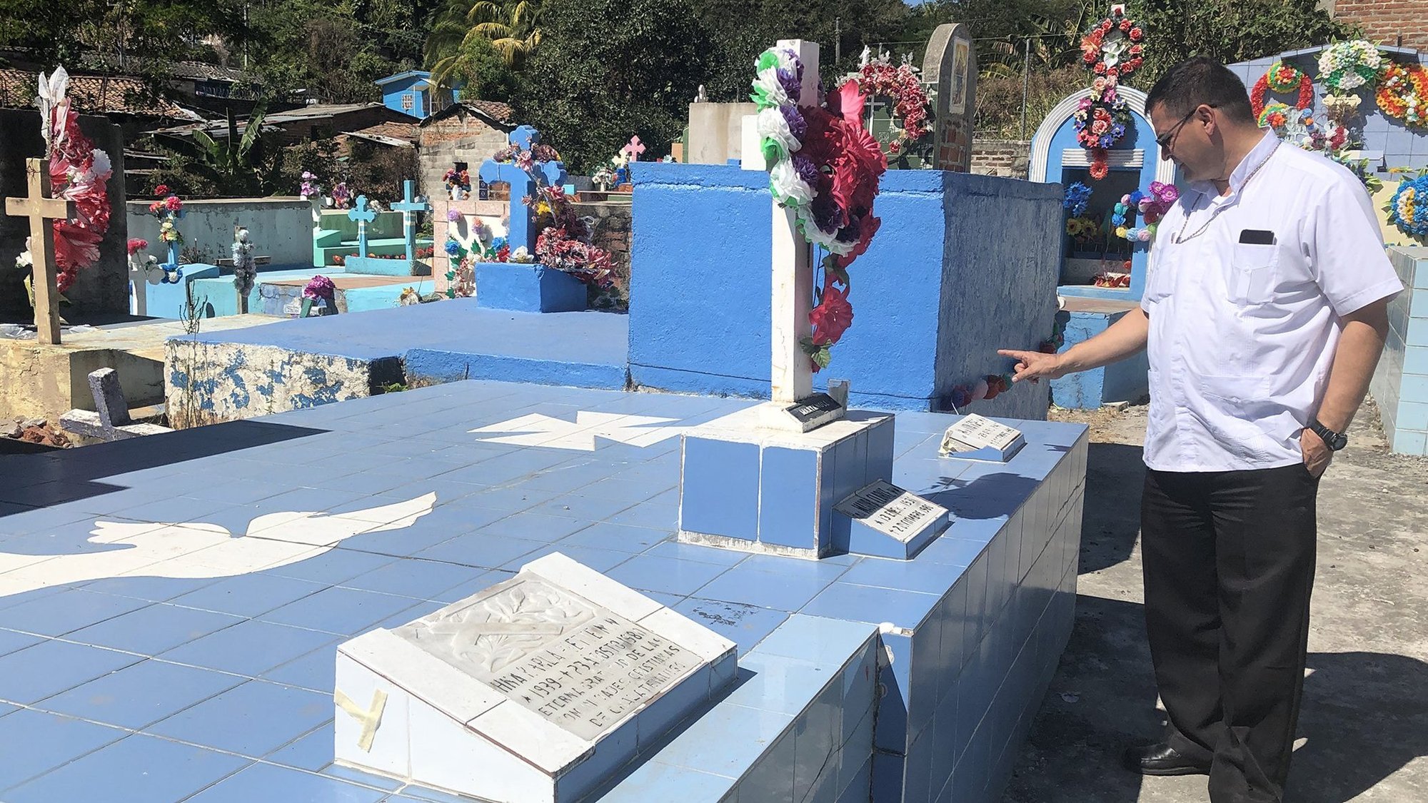 Bishop Oswaldo Escobar Aguilar of Chalatenango, El Salvador, speaks of the work of U.S. Maryknoll Sisters Maura Clarke, Ita Ford and Carla Piette Jan. 11, 2020, at one of the local cemeteries. Sisters Ford and Clarke, who served in Chalatenango and were raped and murdered by Salvadoran military forces along with Ursuline Sister Dorothy Kazel and lay missionary Jean Donovan in 1980, are remembered each Dec. 2, the day of their deaths, in the diocese as part of a long list of local martyrs. (CNS photo/Rhina Guidos)