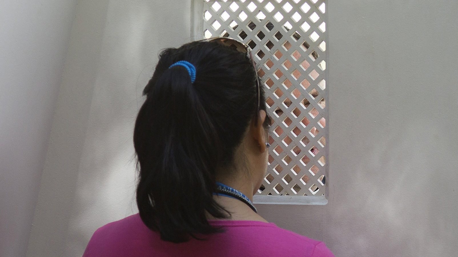 A young woman is pictured in a file photo during confession. New laws passed by Queensland Parliament in Australia Sept. 8, 2020, mean religious institutions and their members are no longer able to use the seal of the confessional as a defense or excuse in child sex abuse matters. (CNS photo/Tyler Orsburn)