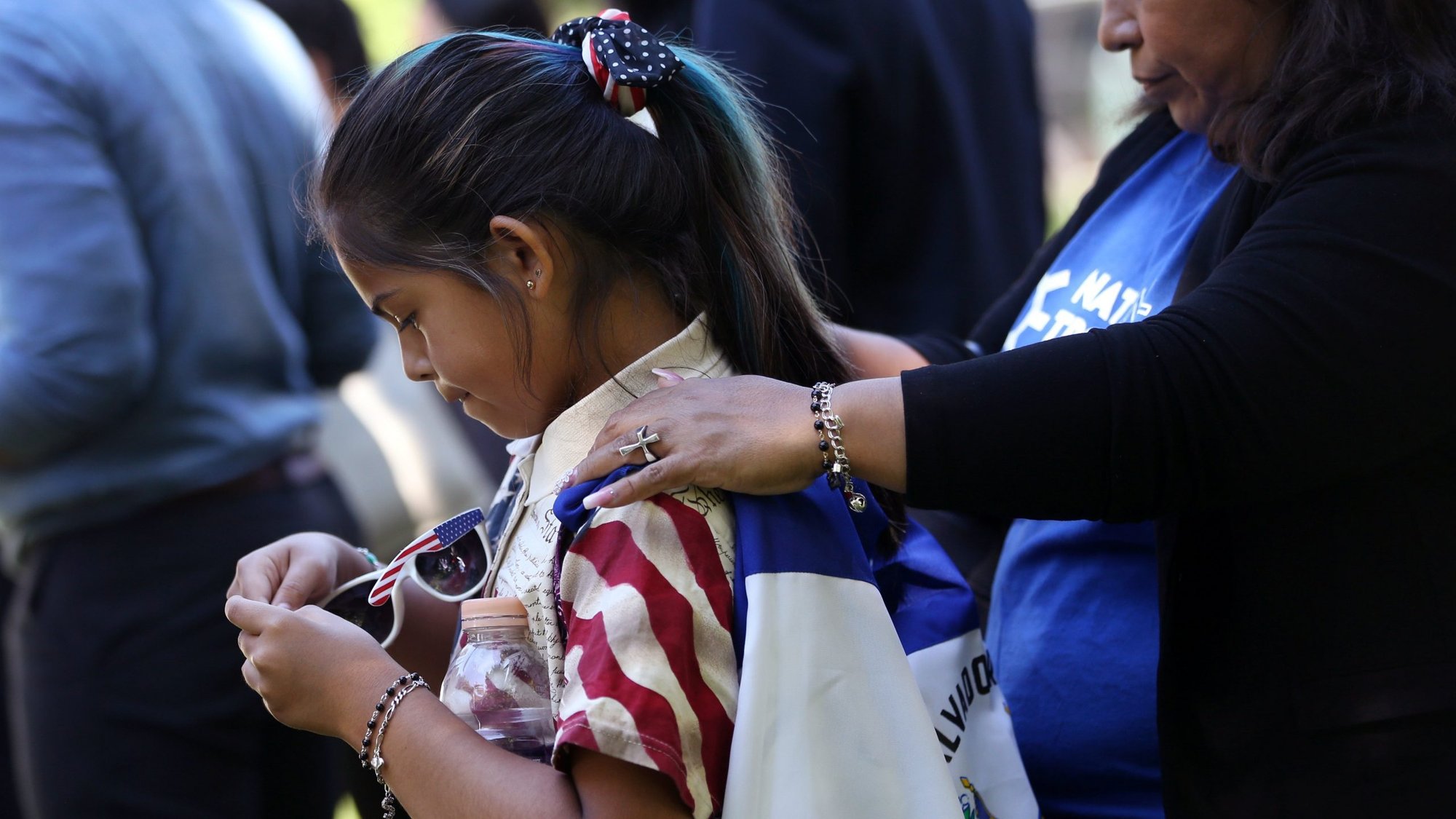 Marilyn Miranda, 9, draped in a Salvadoran flag, attends an immigration rally with her mother outside the U.S. Capitol in Washington June 4, 2019. A Sept. 14, 2020, decision from the U.S. Court of Appeals for 9th Circuit in Ramos v. Nielsen brings the Trump administration one step closer to ending Temporary Protected Status, or TPS, for almost all people with TPS in the United States. (CNS photo/Leah Millis, Reuters)