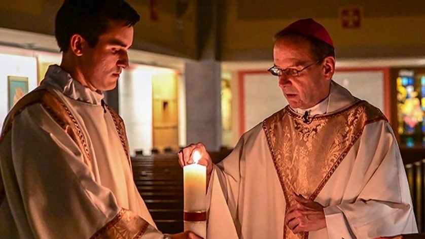 Bishop Michael F. Burbidge of Arlington, Va., lights the paschal candle during a livestreamed Easter Vigil Mass at the Cathedral of St. Thomas More in Arlington April 11, 2020. (CNS photo/Matt Riedl, Catholic Herald)