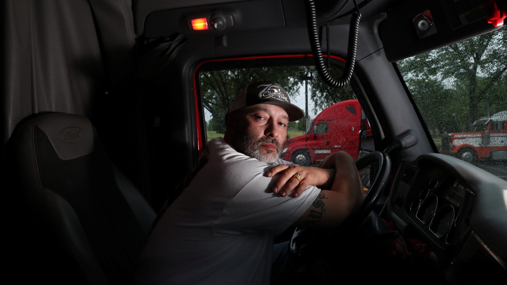 A truck driver in Washington poses for a photo May 8, 2020. (CNS photo/Leah Millis, Reuters)