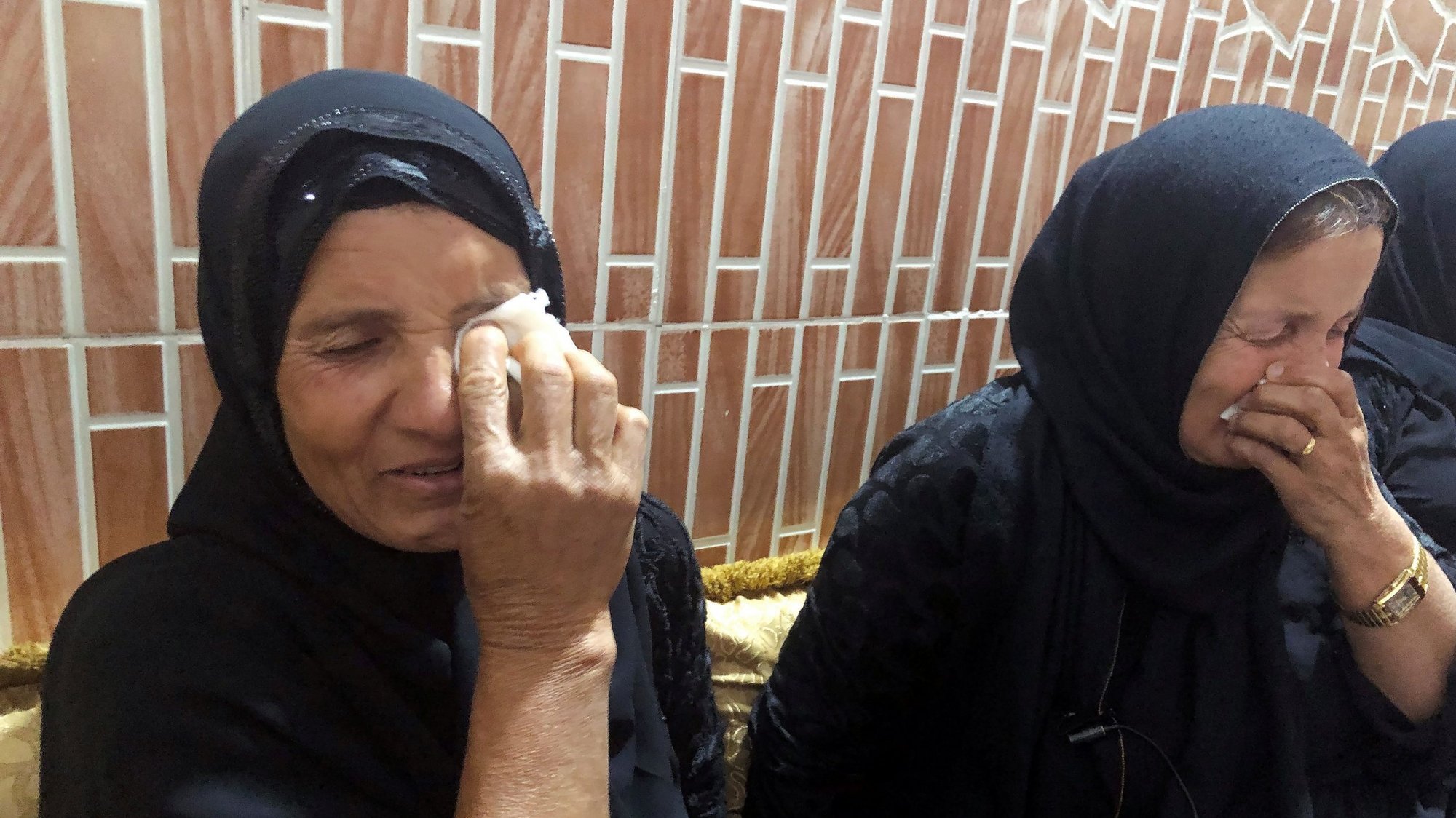 Women mourn the death of a man who was killed in a Turkish airstrike in late June in Sheladize, Iraq. (CNS photo/Kawa Omar, Reuters)