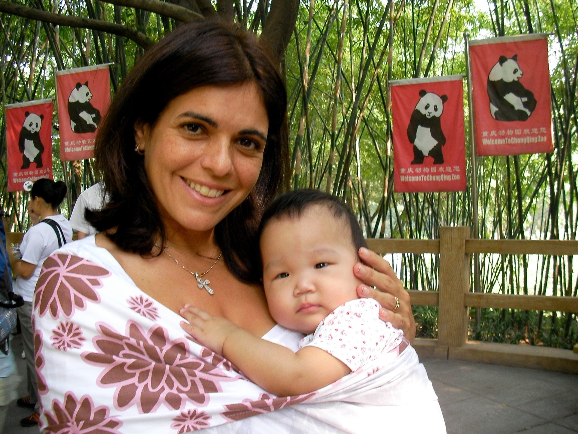 The author with her newly adopted daughter at the Chongqing Zoo in China. (Courtesy Grazie Christie)