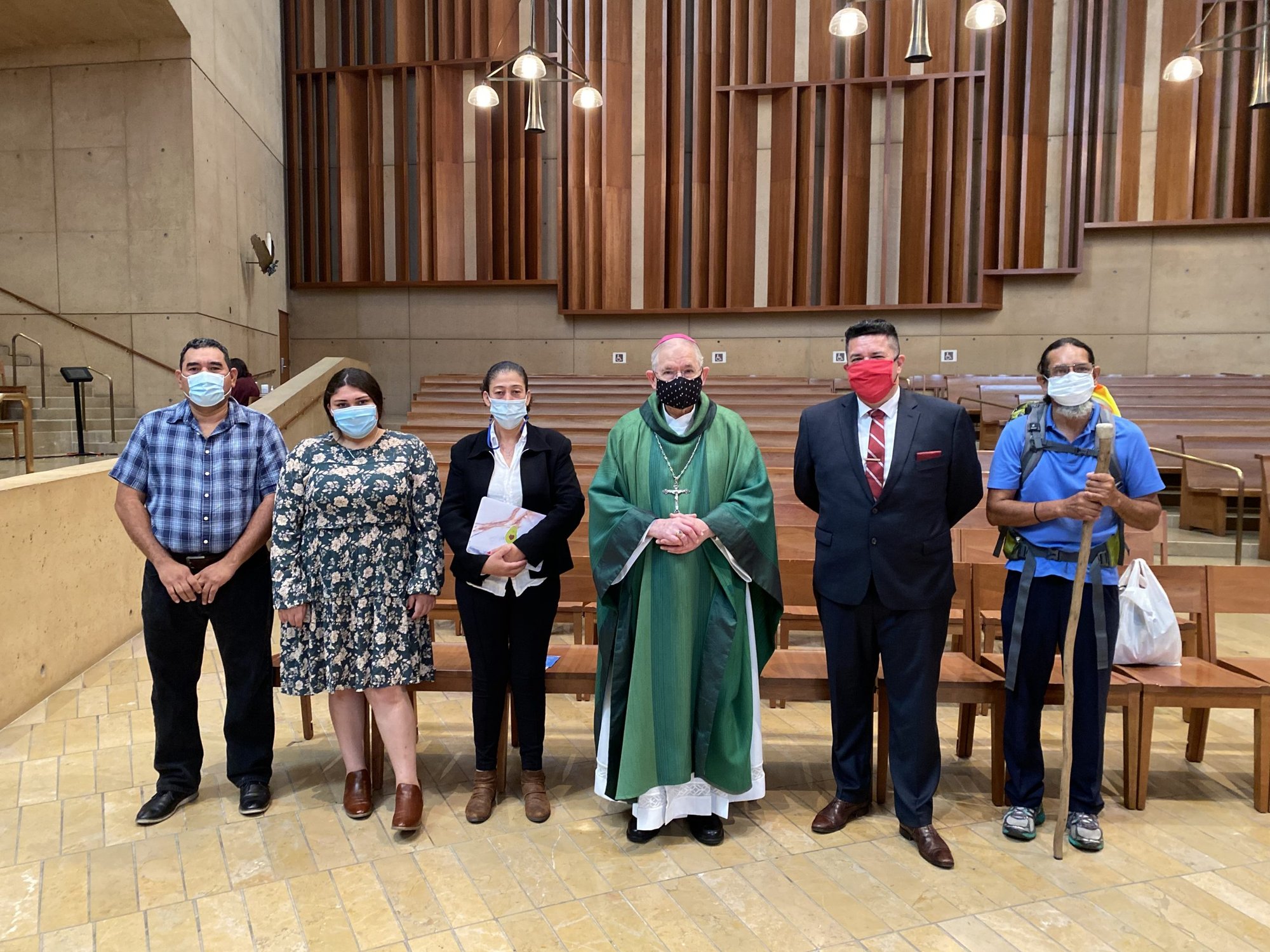 Kaithlyn, a high school student and unaccompanied minor from Nicaragua, with her parents, Archbishop Gomez, Isaac Cuevas, director of Immigration and Public Affairs for the Archdiocese of Los Angeles, and Don Antonio, who completed the walking pilgrimage from Orange County, at this year’s Day in Recognition of All Immigrants. (Courtesy Archdiocese of Los Angeles)