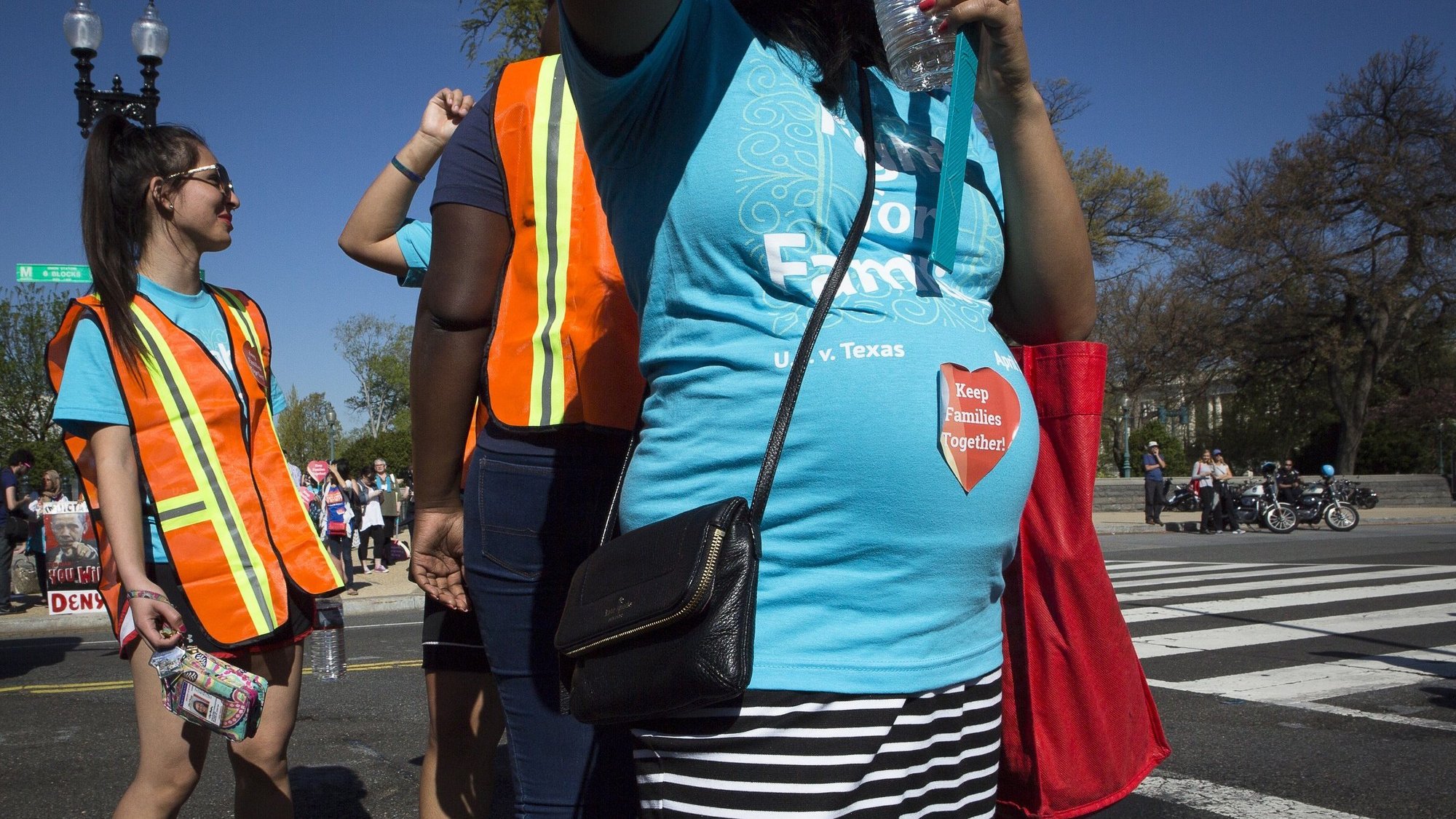 A pregnant woman is seen outside the U.S. Supreme Court in Washington in this 2016 file photo. The Pregnant Workers Fairness Act was passed with a bipartisan vote by the House Sept. 17, 2020. (CNS photo/Tyler Orsburn)