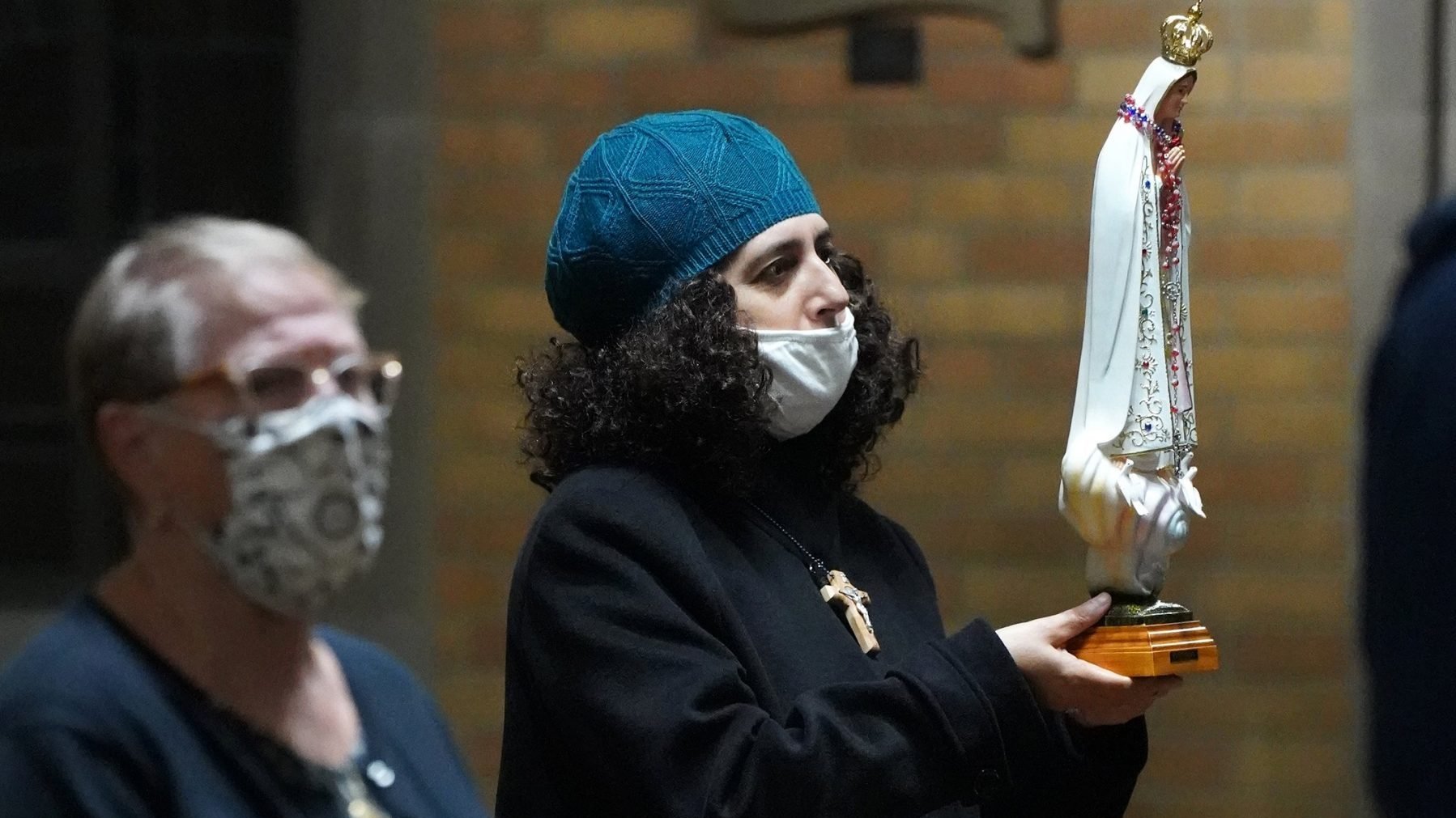 Cindy Lucignano holds a statue of Our Lady of Fatima during the annual Rosary for Life Mass Oct. 1, 2020, at Resurrection Church in Brooklyn, N.Y. (CNS photo/Gregory A. Shemitz)