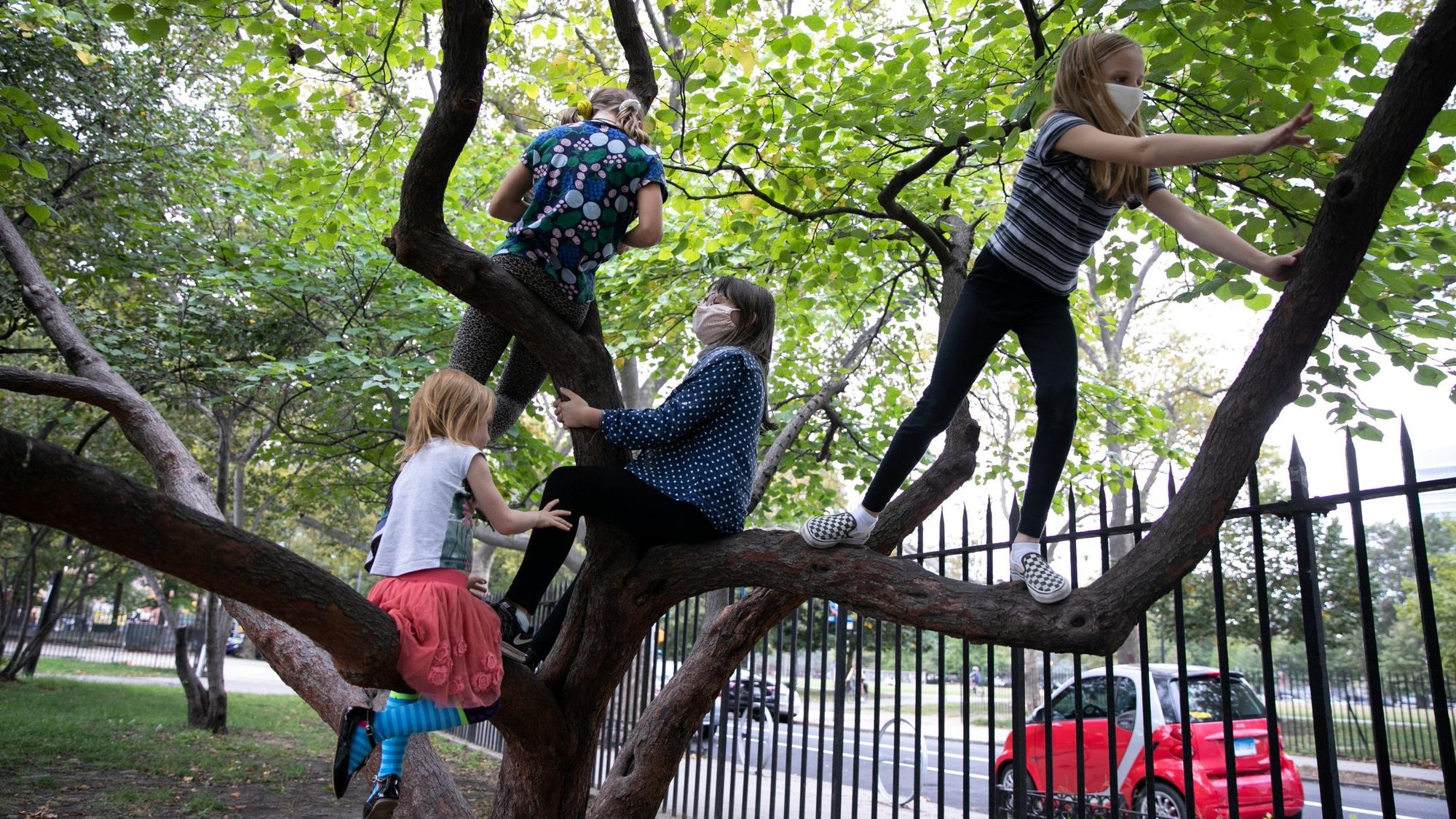 Children in the Brooklyn borough of New York City play after their first day of in-person school Oct. 1, 2020. (CNS photo/Caitlin Ochs, Reuters)