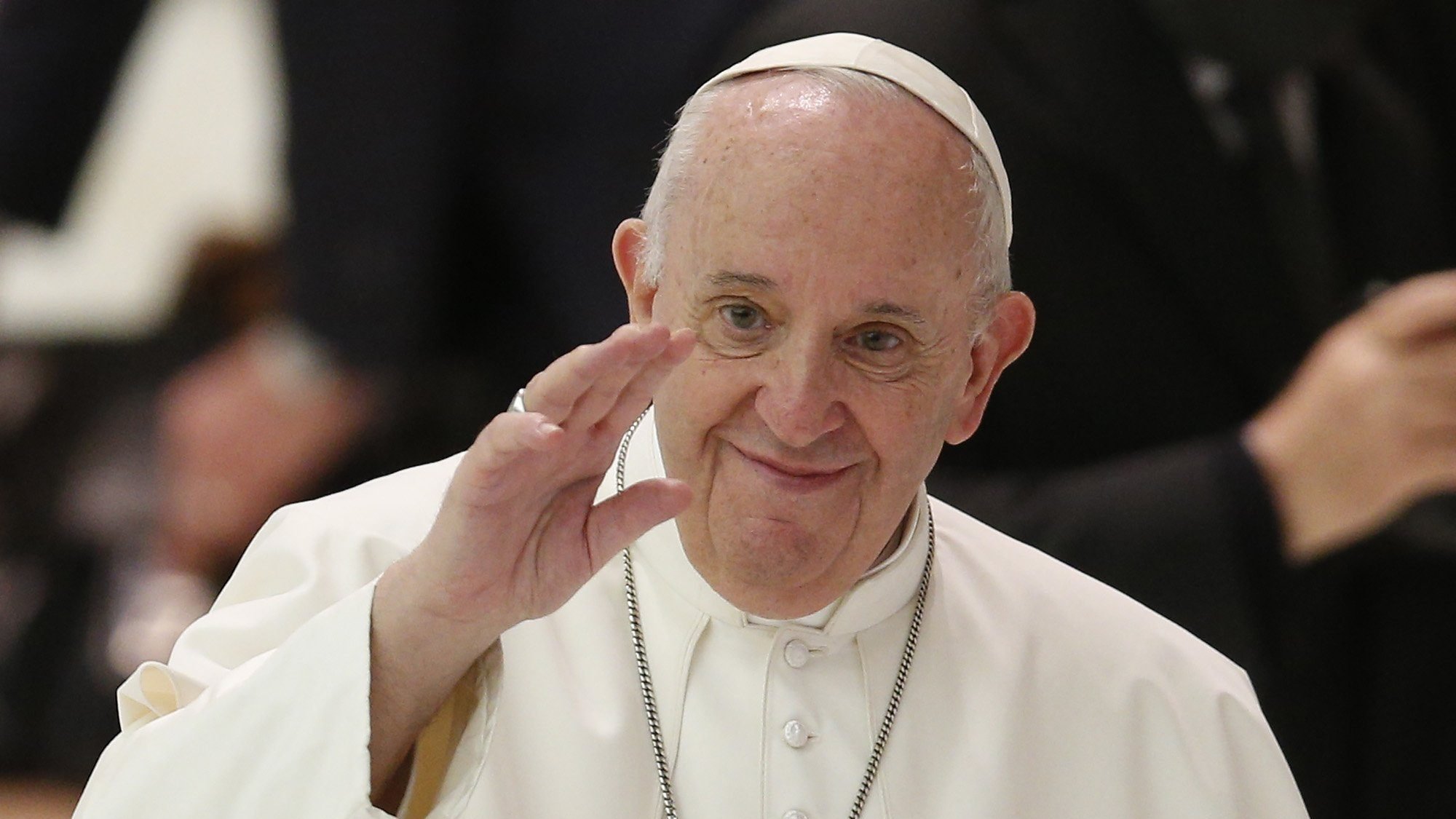 Pope Francis greets the crowd during his general audience in Paul VI hall at the Vatican Oct. 14, 2020. A few days after four Swiss Guards tested positive for COVID-19, the pope broke from his normal pattern and did not personally greet people in the crowd. (CNS photo/Paul Haring)