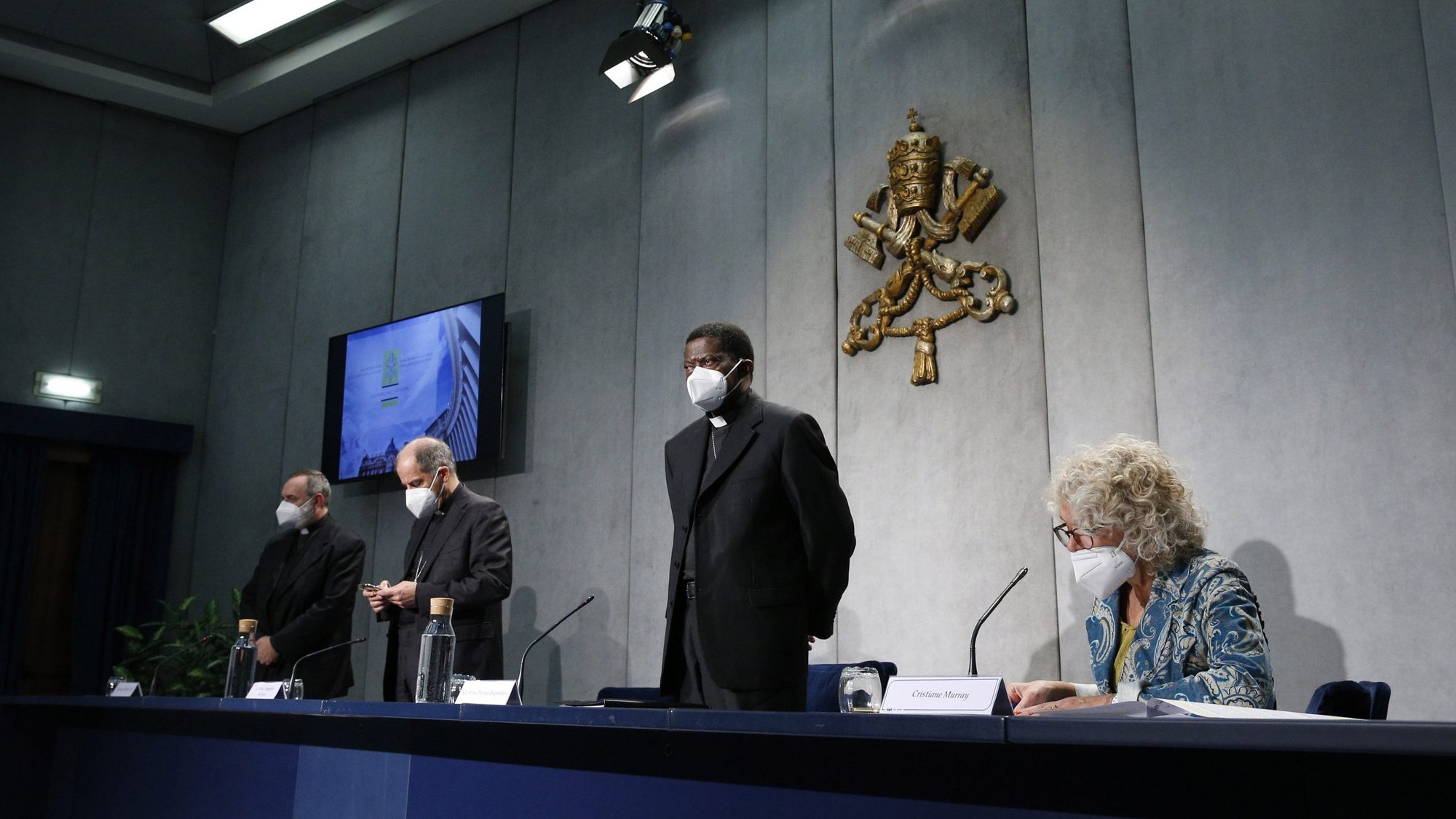 Leaders of the Congregation for the Evangelization of Peoples hold a news conference at the Vatican Oct. 16, 2020. The topic was World Mission Sunday, which will be observed Oct. 18. Pictured from left are Oblate Father Tadeusz J. Nowak, secretary-general of the pontifical mission societies; Archbishop Giampietro Dal Toso, adjunct secretary of the Congregation for the Evangelization of Peoples; Archbishop Protase Rugambwa, secretary of the Congregation for the Evangelization of Peoples; and Cristiane Murray, vice director of the Vatican Press Office. (CNS photo/Paul Haring)