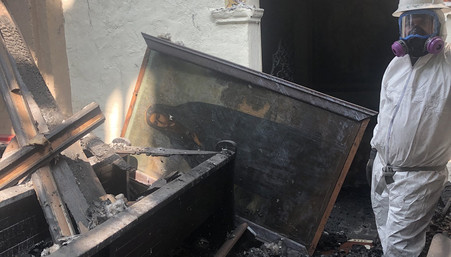 A centuries-old mysterious painting of “La Dolorosa” was pulled out of the rubble of the fire-wrecked Mission San Gabriel on Sept. 15, the feast of Our Lady of Our Sorrows. (Daniel Macias)
