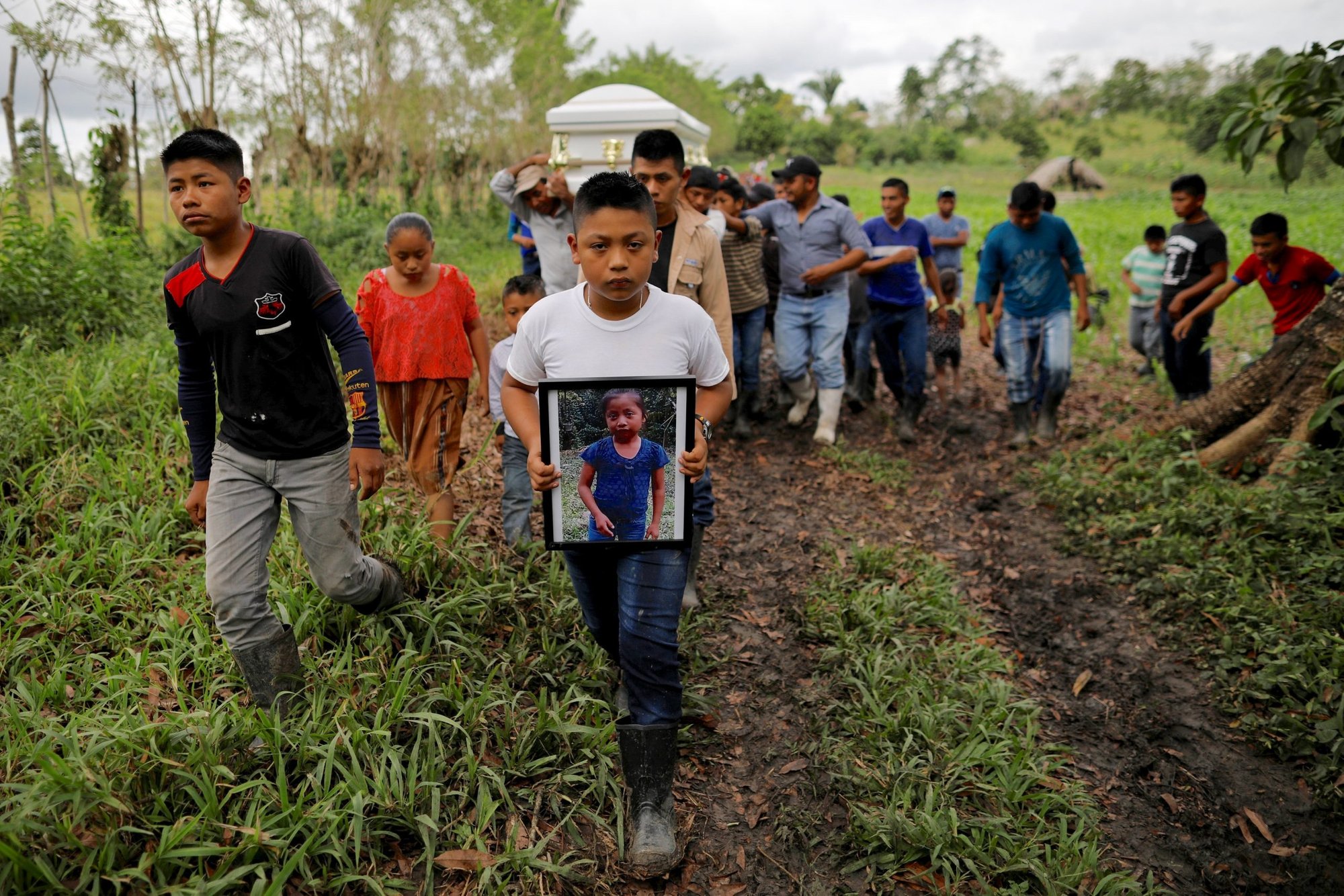 Friends and family carry the casket of Jakelin Caal Maquin during her burial on Christmas Day 2018 in San Antonio Secortez, Guatemala. (Catholic News Service/Carlos Barria, Reuters)