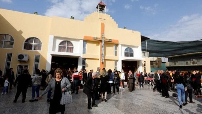Iraqi Christians in Baghdad leave Christmas Mass at St. George Chaldean Church Dec. 25, 2019. (Khalid al Mousily/Reuters/CNS via Crux)