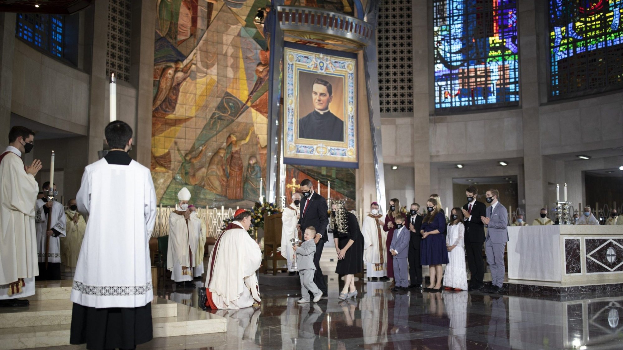 Cardinal Joseph W. Tobin of Newark, N.J., accepts a relic from Michael "Mikey" McGivney Schachle, during the Oct. 31, 2020, beatification Mass of Blessed Michael McGivney, founder of the Knights of Columbus, at the Cathedral of St. Joseph in Hartford, Conn. (CNS photo/courtesy Knights of Columbus)