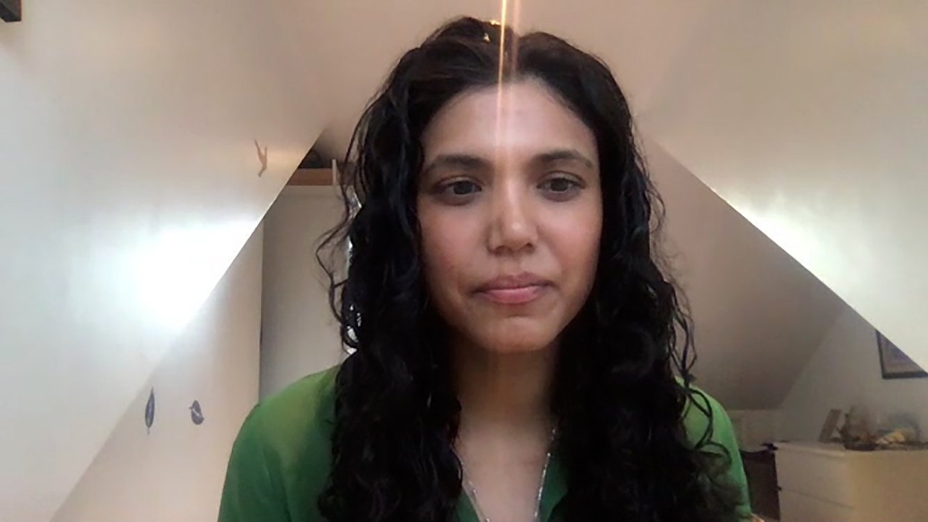 Maria Carvalho, senior consultant for climate policy and carbon pricing at South Pole in London, speaks in a Zoom interview Nov. 20, 2020, about why about why she joined the Economy of Francesco project. The project brought together 2,000 young adult economists, entrepreneurs and "changemakers" to discuss ways to make the economy respond to the needs of the poor and of the planet. (CNS photo/Screen Grab)