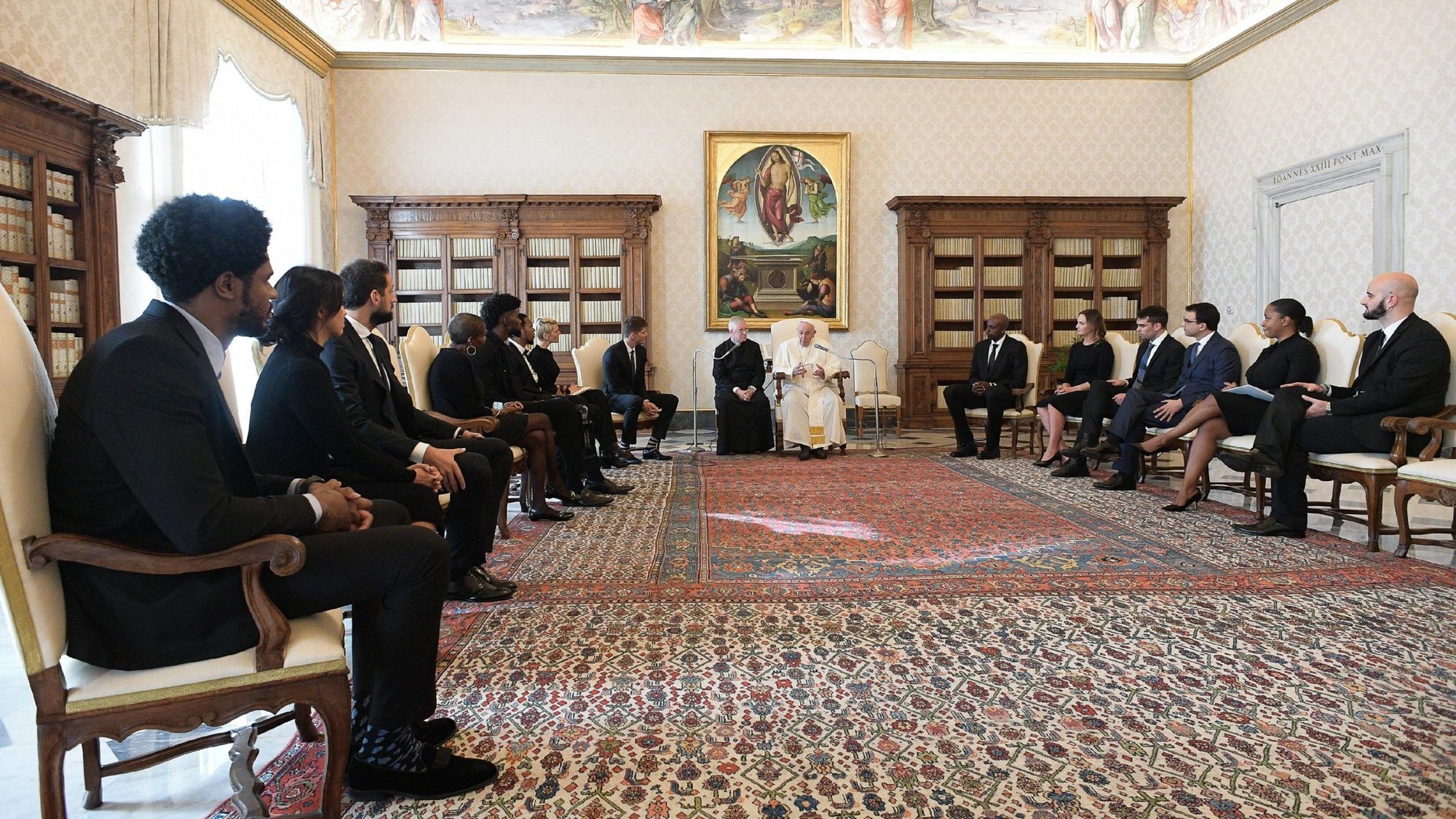 Pope Francis meets with a delegation from the National Basketball Players Association during a private audience at the Vatican Nov. 23, 2020. The group included Marco Belinelli of the San Antonio Spurs; Sterling Brown of the Milwaukee Bucks; Jonathan Isaac of the Orlando Magic; Kyle Korver of the Milwaukee Bucks; and Anthony Tolliver, a free agent who most recently played for the Memphis Grizzlies. (CNS photo/Vatican Media)