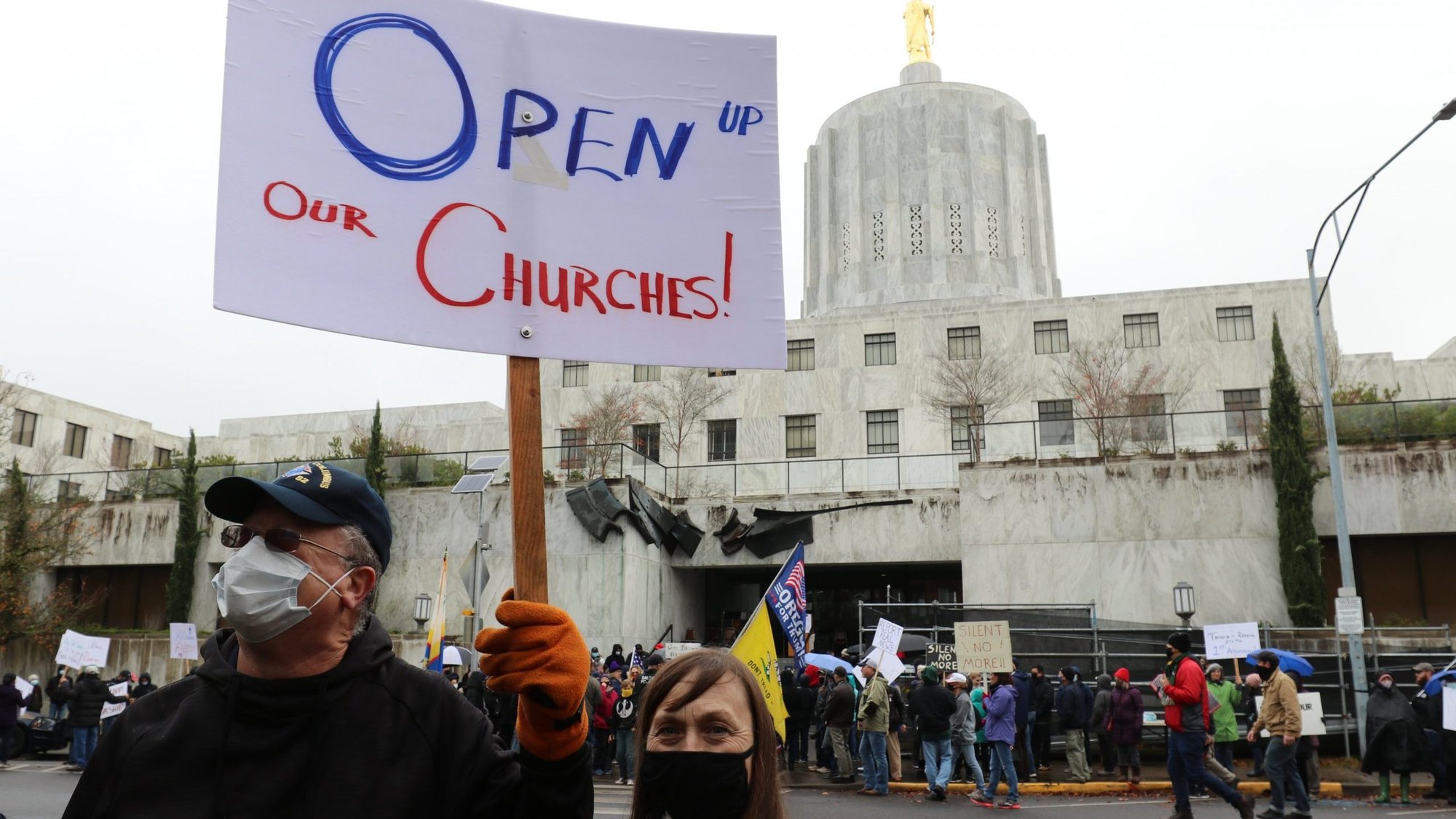 Patrick and Cindy Rice of St. Peter Parish in Newberg, Ore., join a religious freedom rally in Salem Nov. 28, 2020. (CNS photo/Ed Langlois, Catholic Sentinel)