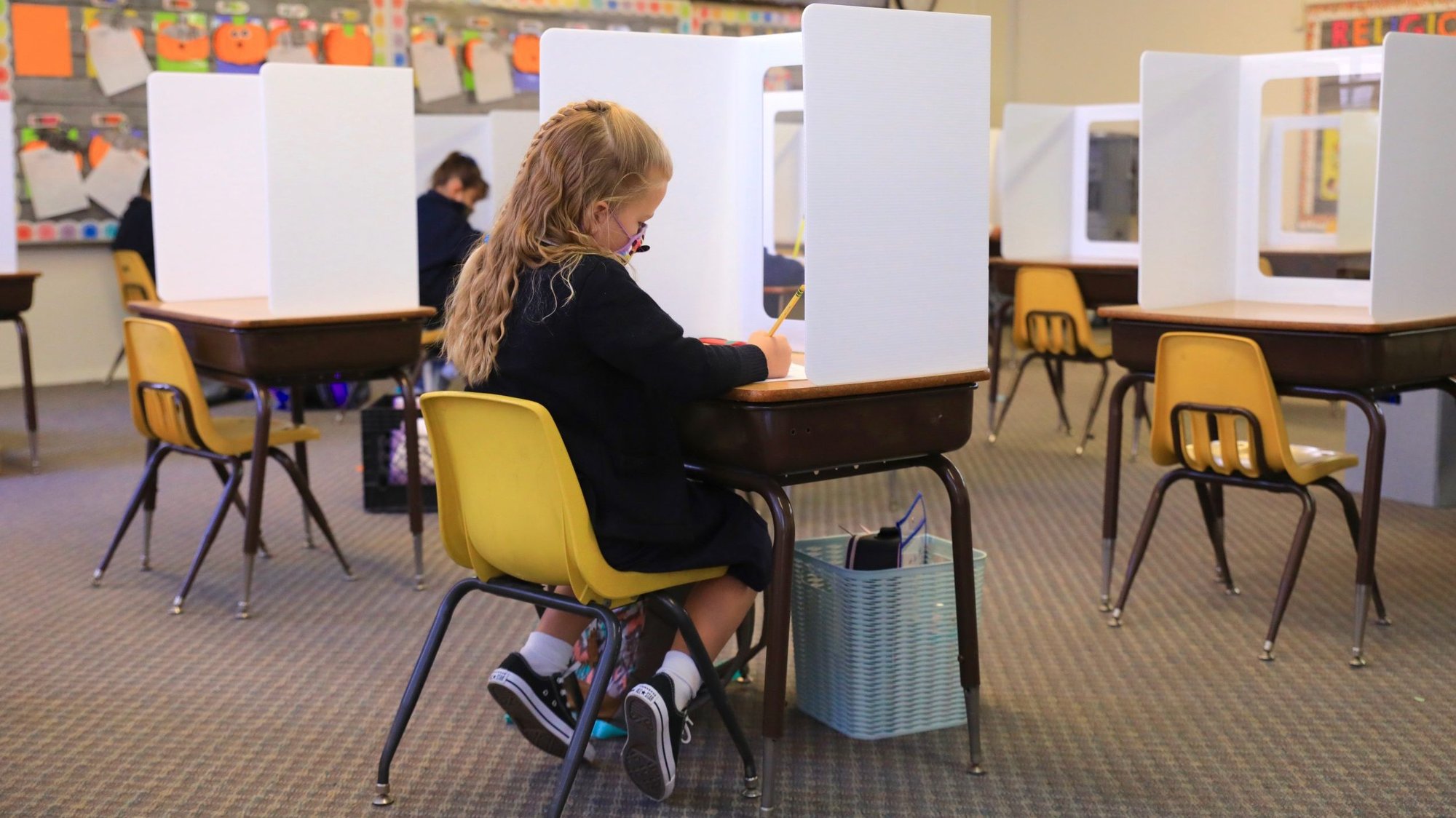 A student at St. Maria Goretti School on the first day of in-person instruction Oct. 26. (David Amador Rivera)