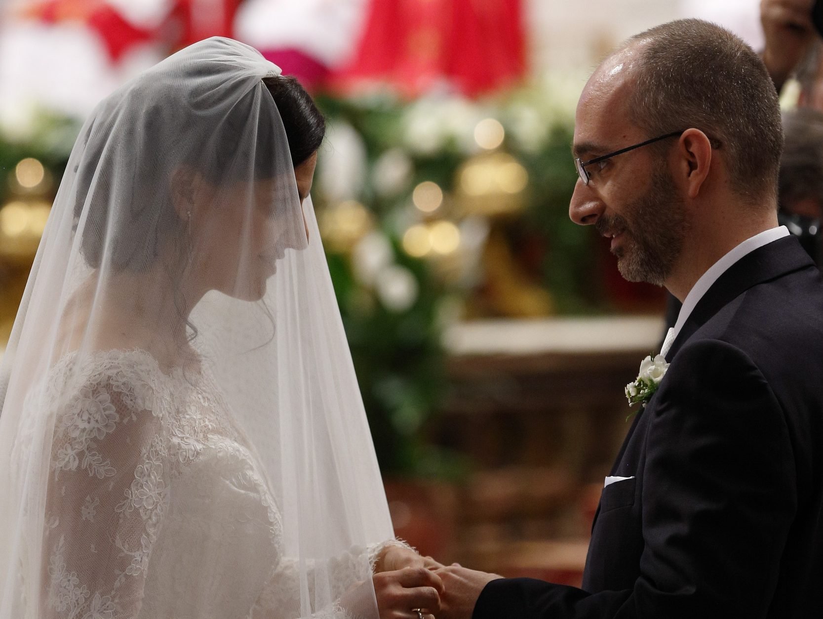 New spouses exchange rings as Pope Francis celebrates the marriage rite for 20 couples during Mass at the Vatican in 2016. (Catholic News Service/Paul Haring)