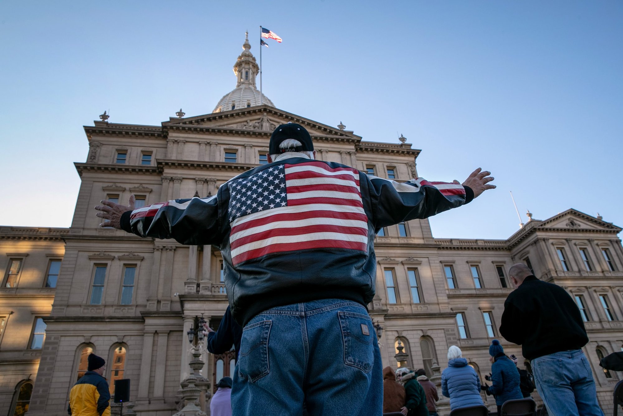 Christian faithful pray during a "Pure Michigan Election Intercession" outside the state capitol building on October 31, 2020 in Lansing, Michigan. (John Moore/Getty Images)
