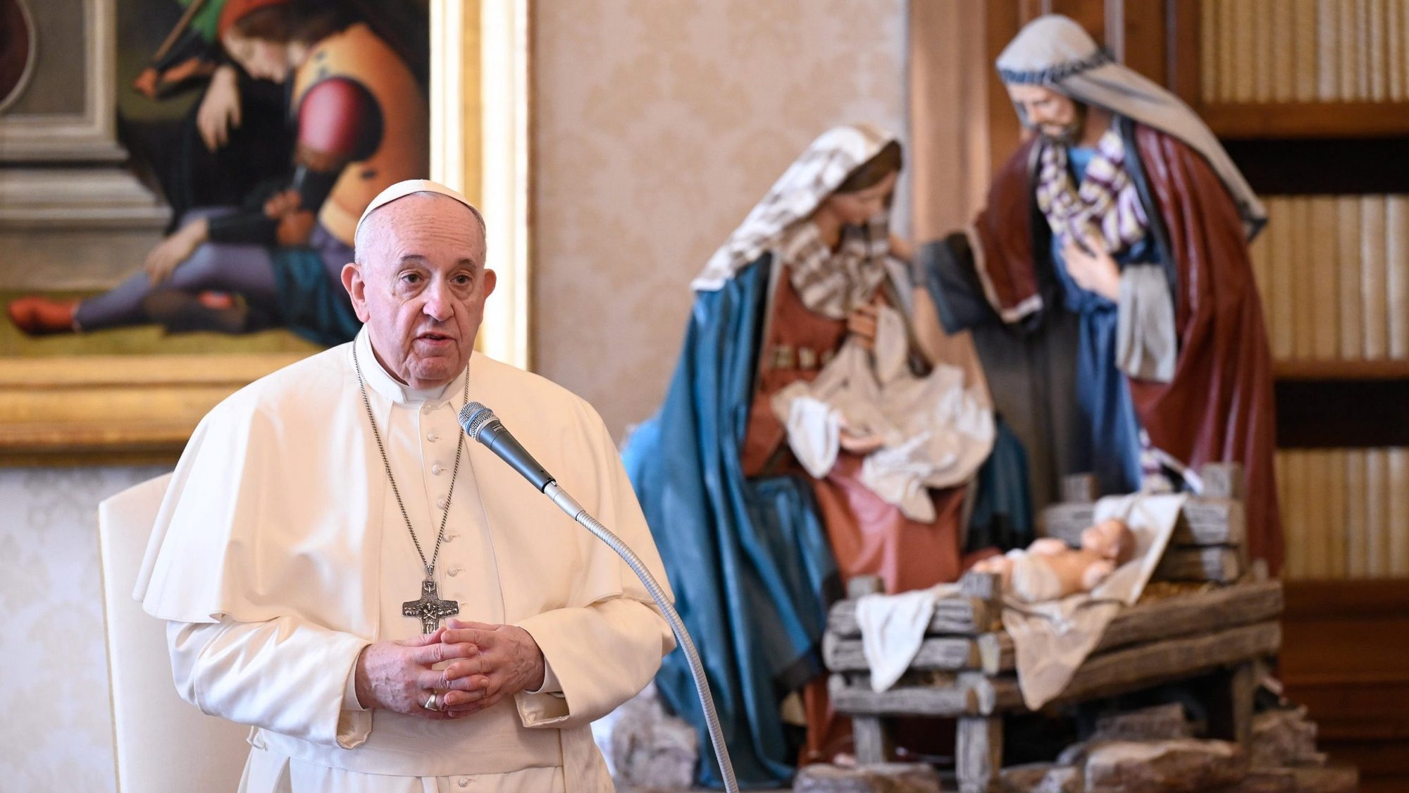 A Nativity scene is pictured as Pope Francis leads his general audience in the library of the Apostolic Palace at the Vatican Dec. 16, 2020. (CNS photo/Vatican Media)