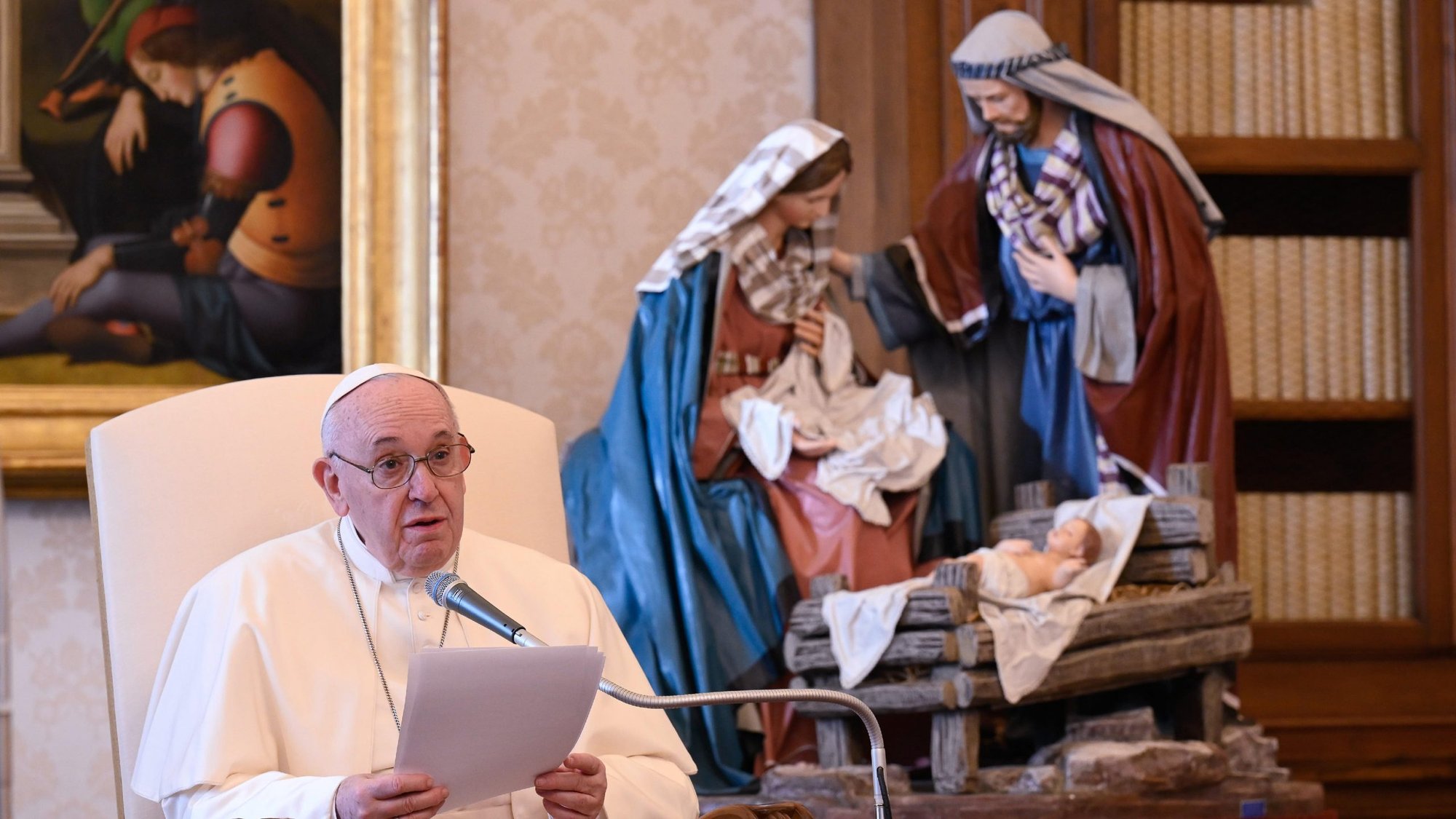 A Nativity scene is pictured as Pope Francis leads his general audience in the library of the Apostolic Palace at the Vatican Dec. 16, 2020. (CNS photo/Vatican Media)