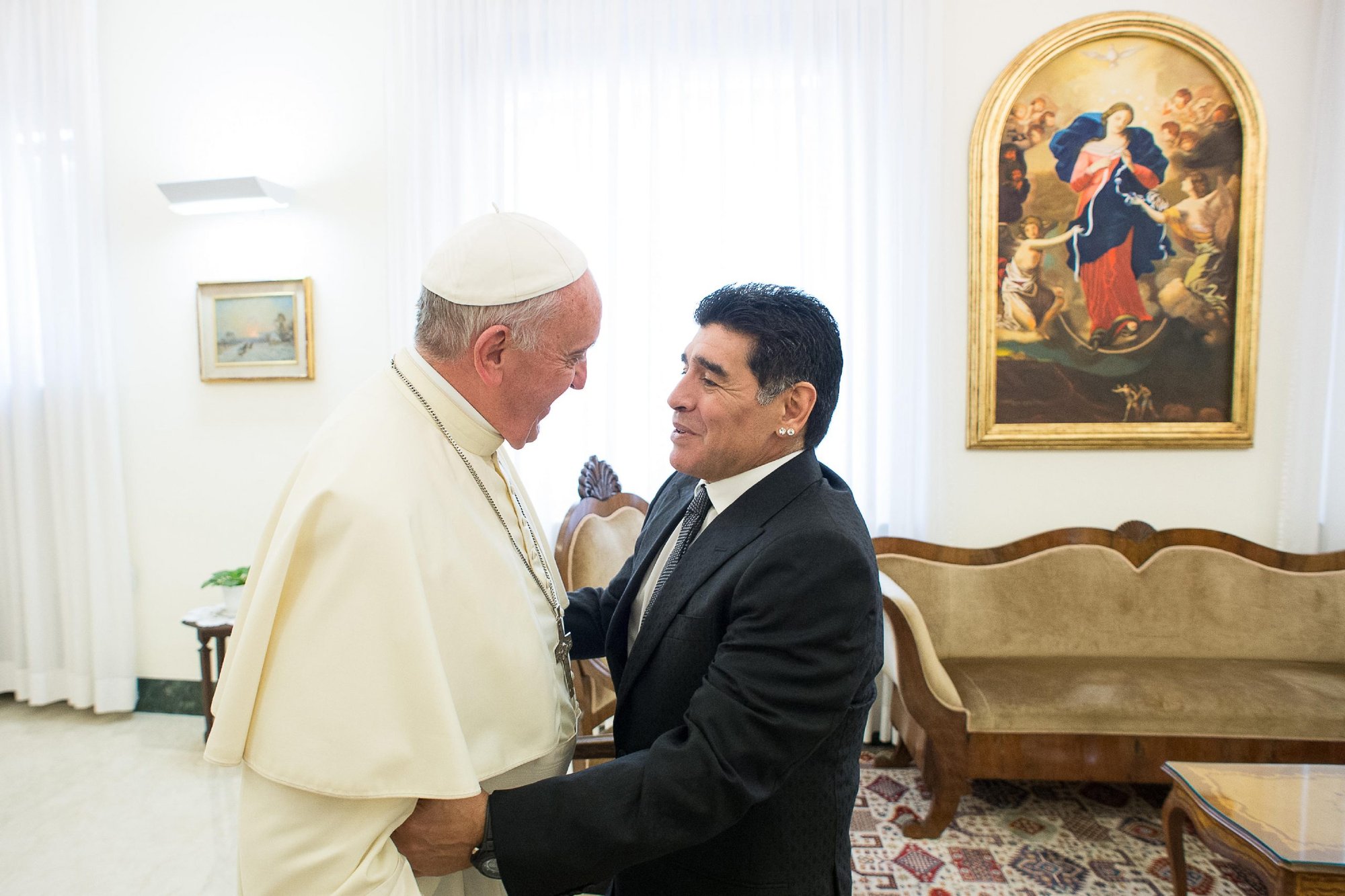 Pope Francis greets Diego Maradona at the Vatican in 2014. The former soccer star died of heart failure Nov. 25 at the age of 60. (Filippo Monteforte/AFP via Getty Images)