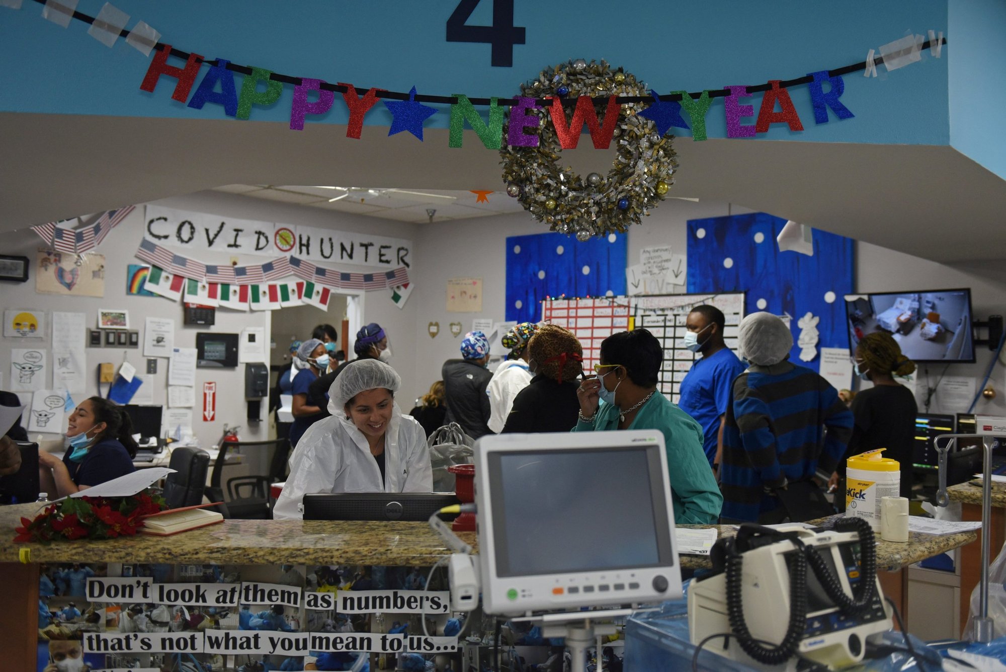 Health care workers at United Memorial Medical Center in Houston treat patients infected with COVID-19 on New Year's Eve Dec. 31, 2020. (CNS photo/Callaghan O'Hare, Reuters)