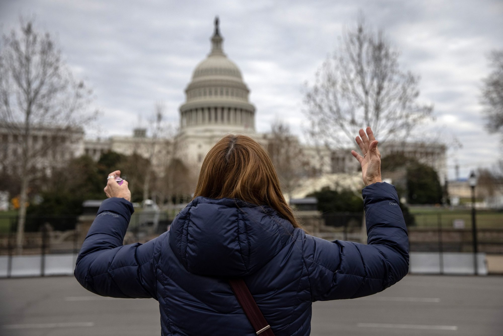 Tamy Ingvaldson prays for peace outside the U.S. Capitol on Jan. 8 in Washington, D.C. (John Moore/Getty Images)