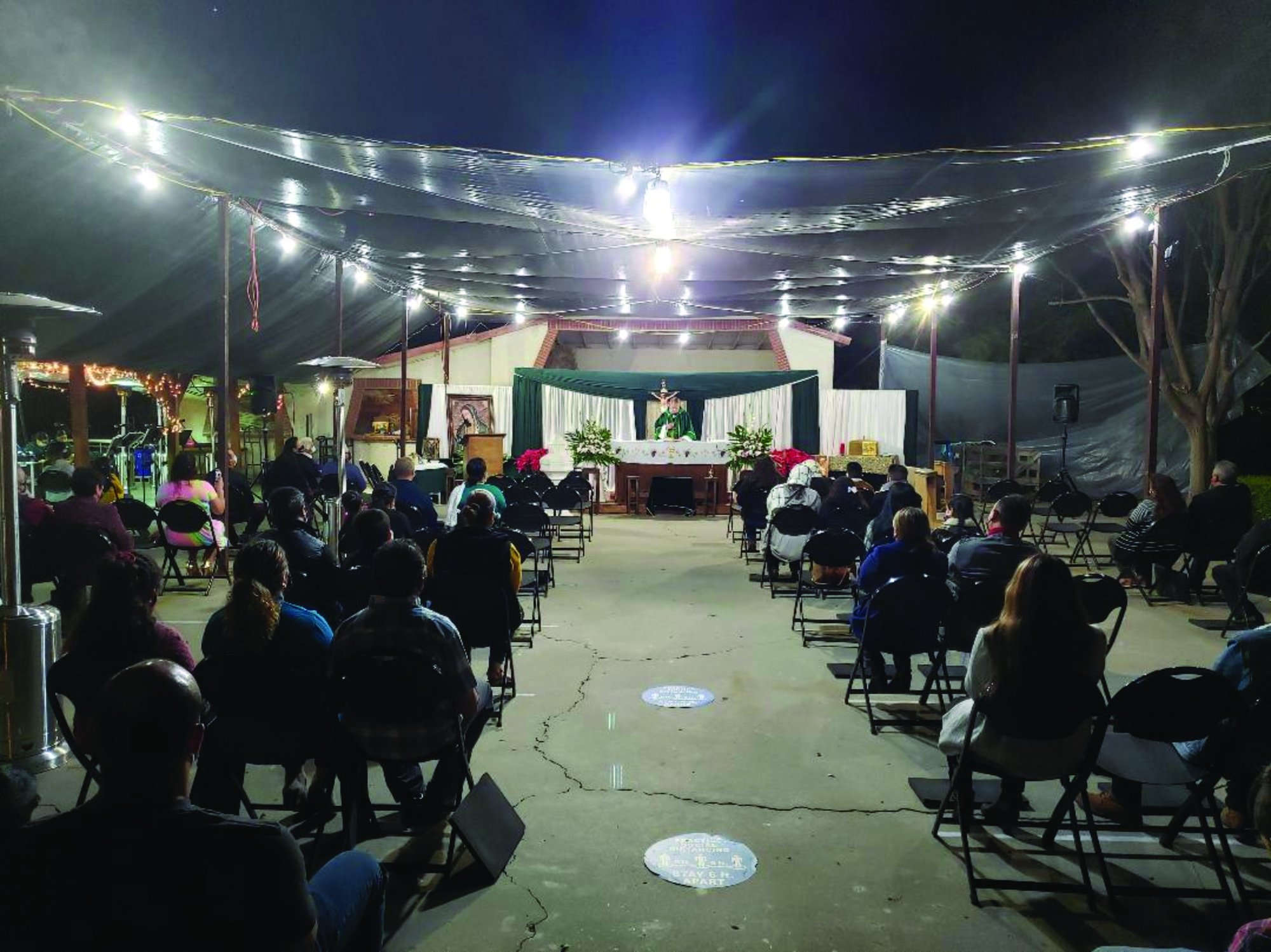 Father Barney Gatlin presides at a Saturday evening Mass for socially distanced San Salvador Mission parishioners in Piru on Jan. 16. (Armando Rodriguez)