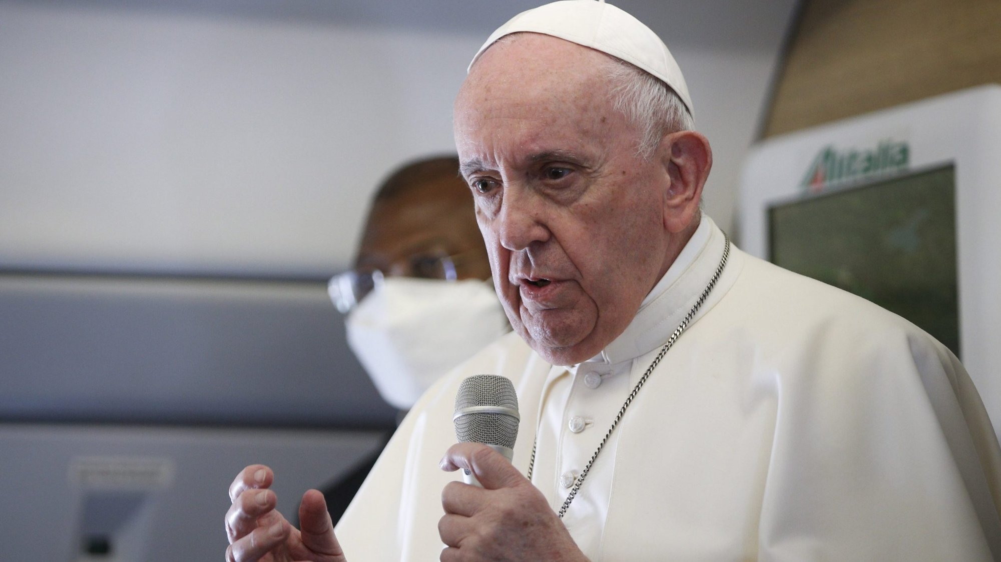 Pope Francis speaks with journalists aboard his flight from Baghdad to Rome March 8, 2021. (CNS photo/Paul Haring)