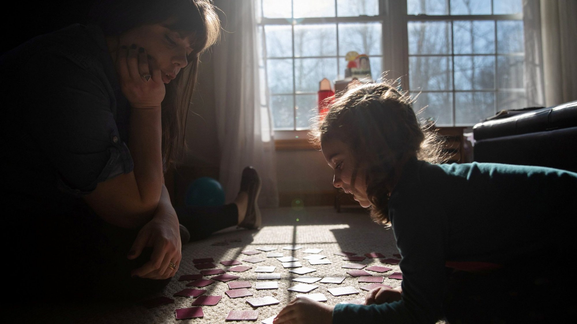 A mother and daughter are seen in their Grand Rapids, Mich., home March 2, 2021, amid the coronavirus pandemic, which has taken an emotional toll on Americans. Mental health professionals report they are getting more requests for assistance from people feeling helpless and experiencing anxiety and depression. (CNS photo/Emily Elconin, Reuters)