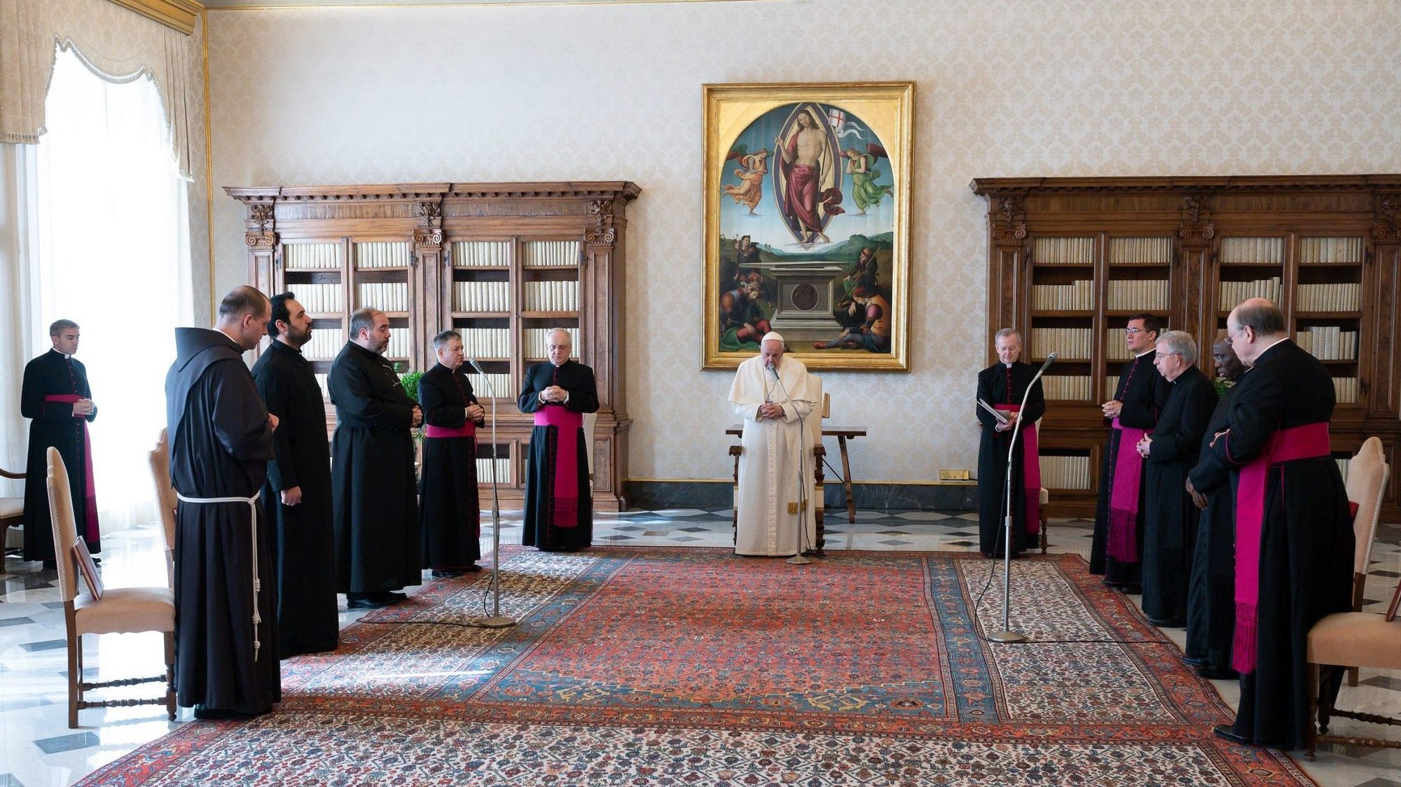 Pope Francis prays as he leads his general audience in the library of the Apostolic Palace at the Vatican March 10, 2021. The pope recalled his recent visit to Iraq and said it was meant to be "a sign of hope" for the people of the country who suffered from war, terrorism and the pandemic. (CNS photo/Vatican Media)