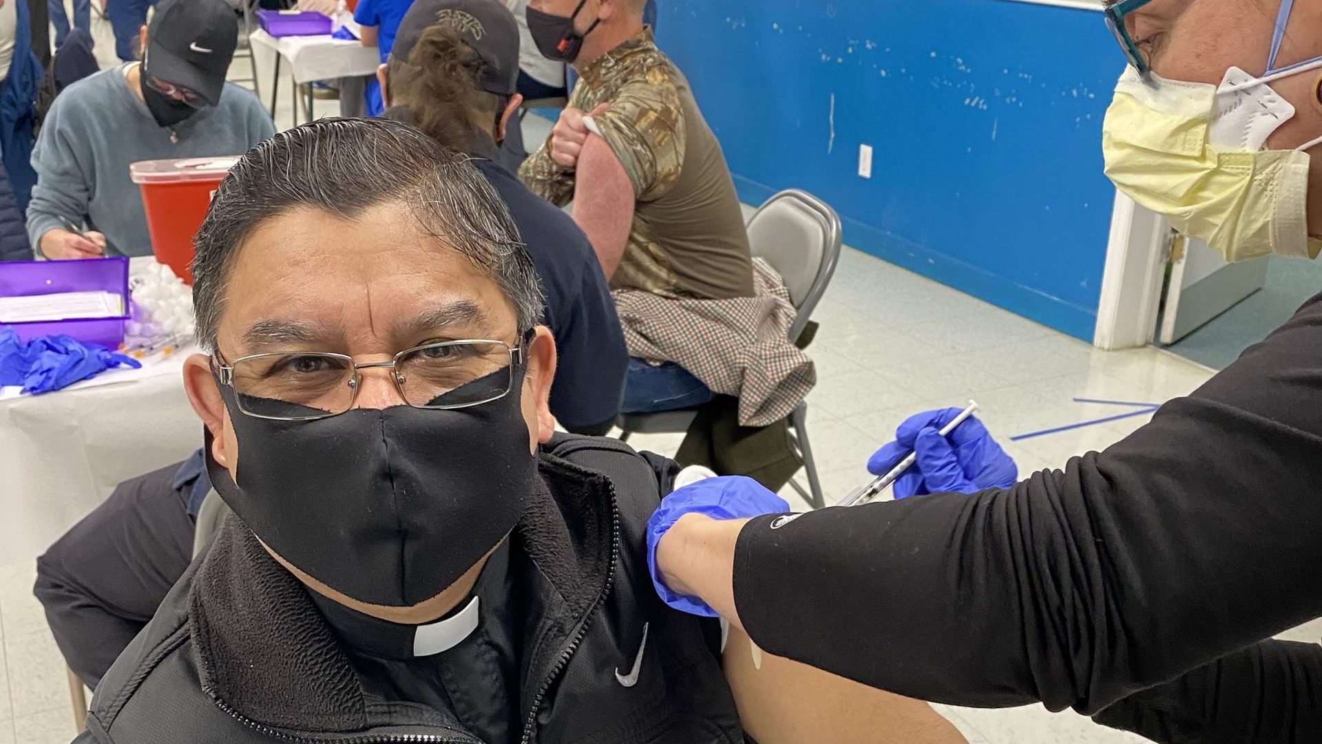 Father Gabriel Carvajal Salazar get his COVID-19 vaccine at Our Lady of the Highways Church in Thomasville, N.C., March 6, 2021. Almost 600 doses of the Pfizer vaccine were administered during the clinic sponsored by a local pediatrician and the local health department. (CNS photo/Joe Thornton, Catholic News Herald)