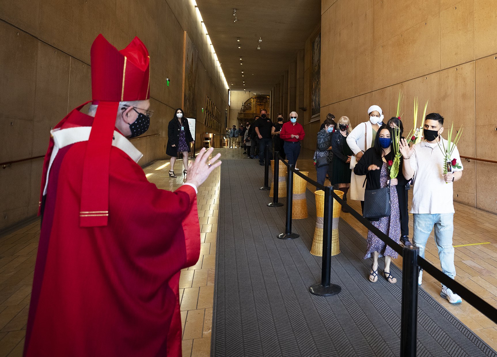 Archbishop José H. Gomez of Los Angeles greets faithful at the Cathedral of Our Lady of the Angels in Los Angeles on Palm Sunday, March 28, 2021. (Victor Aleman)