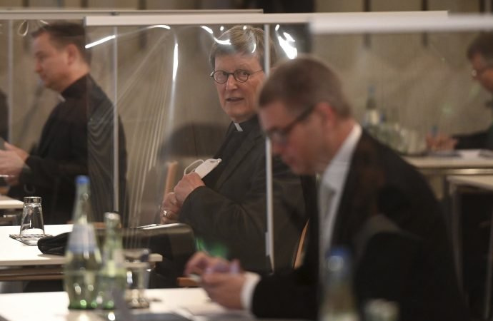 Cologne's archbishop Rainer Maria Woelki, center, attends a news conference on a report of abuse by clergy in Cologne, Germany, Thursday, March 18, 2021. Faced with accusations of trying to cover up sexual violence in Germany's most powerful Roman Catholic diocese, the archbishop of Cologne publishes the independent investigation. (Ina Fassbender/Pool via AP, image via Crux)