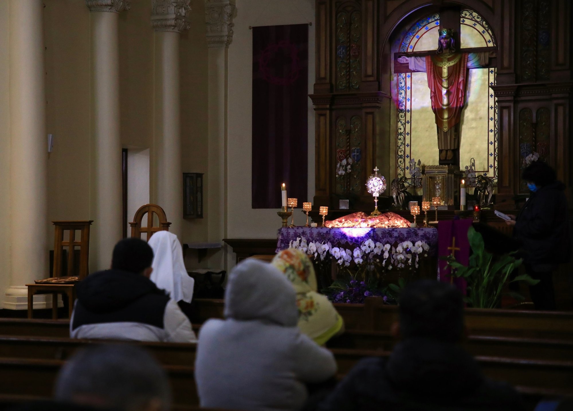 Parishioners pray before the Blessed Sacrament during the 7 p.m. Lenten Holy Hour at Christ the King Church near Hollywood on Friday, March 12 (David Amador Rivera)