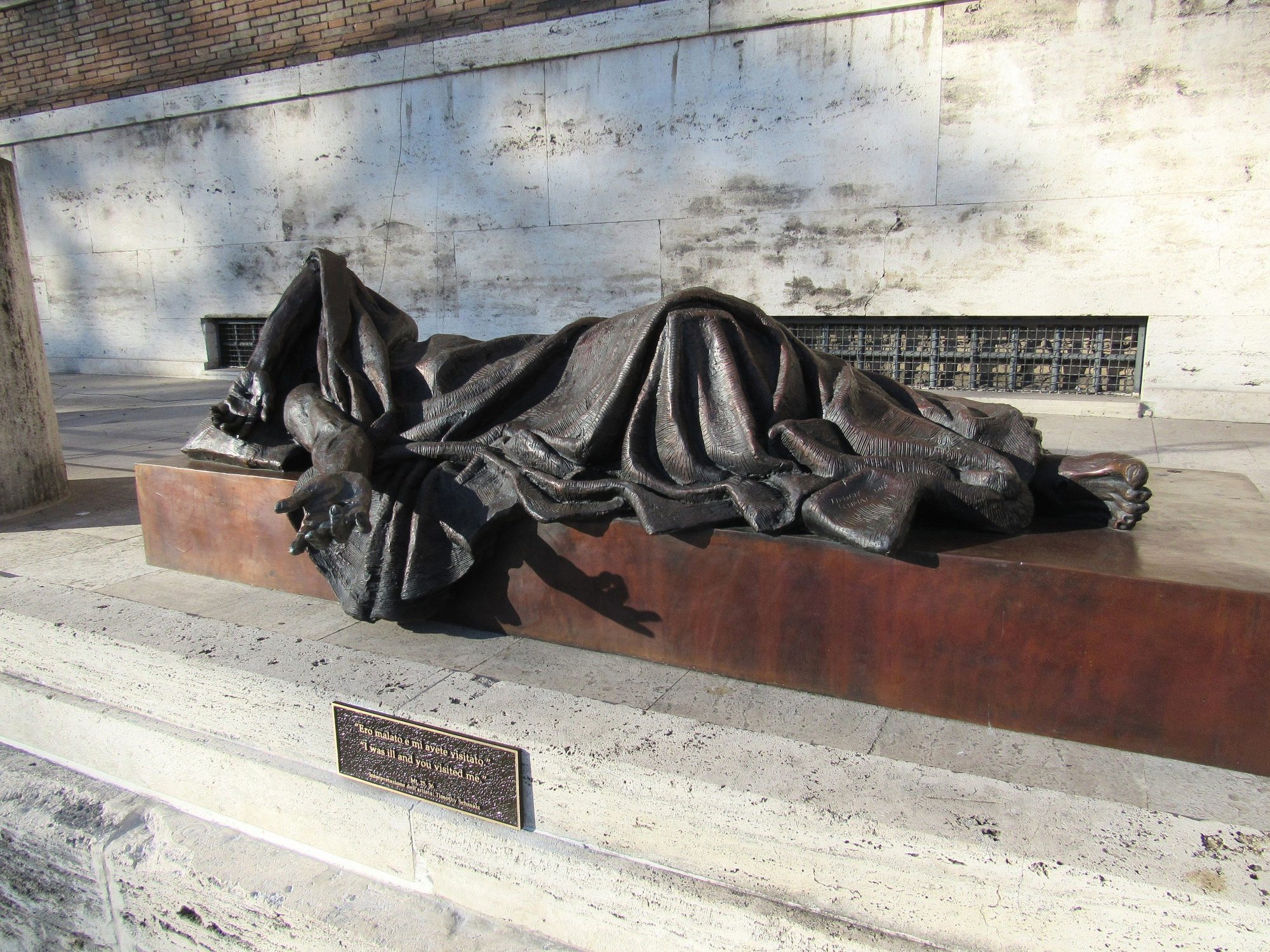 Timothy Schmalz's sculpture "When I Was Sick" is displayed on a Rome street Feb. 9, 2017. The artist will create a replica of the statue that will be part of a COVID-19 memorial planned for Mercy Health -- St. Elizabeth Youngstown Hospital in Ohio. The memorial is expected to be completed sometime in September 2021. (CNS photo/courtesy St. Elizabeth Youngstown Hospital)