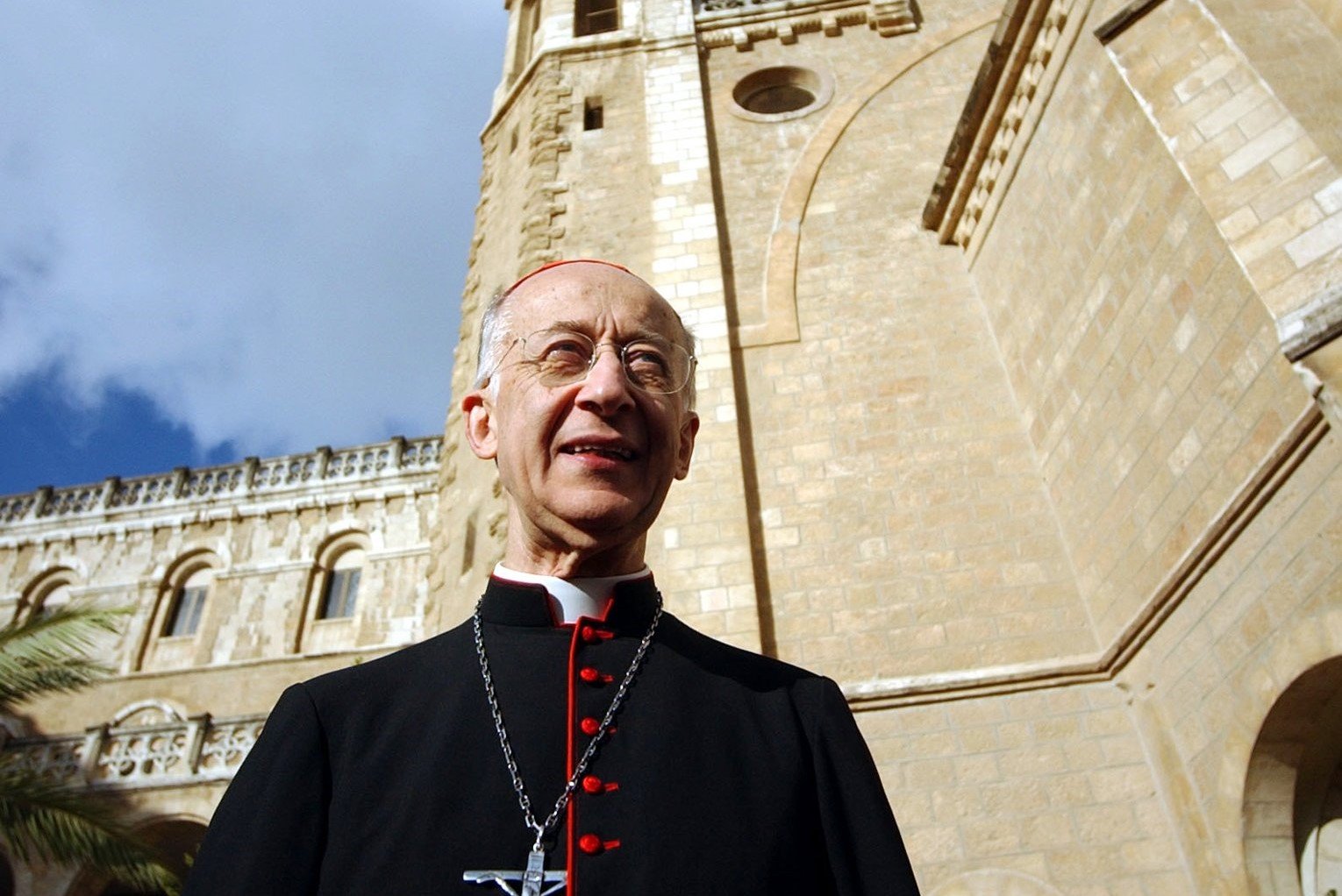 Italian Cardinal Camillo Ruini stands in the courtyard of Notre Dame Center in Jerusalem April 23, 2004 during his visit to the Holy Land for an Italian-sponsored peace run. Cardinal Ruini is papal vicar of Rome and president of the Italian bishops' conference. (CNS photo by Debbie Hill)