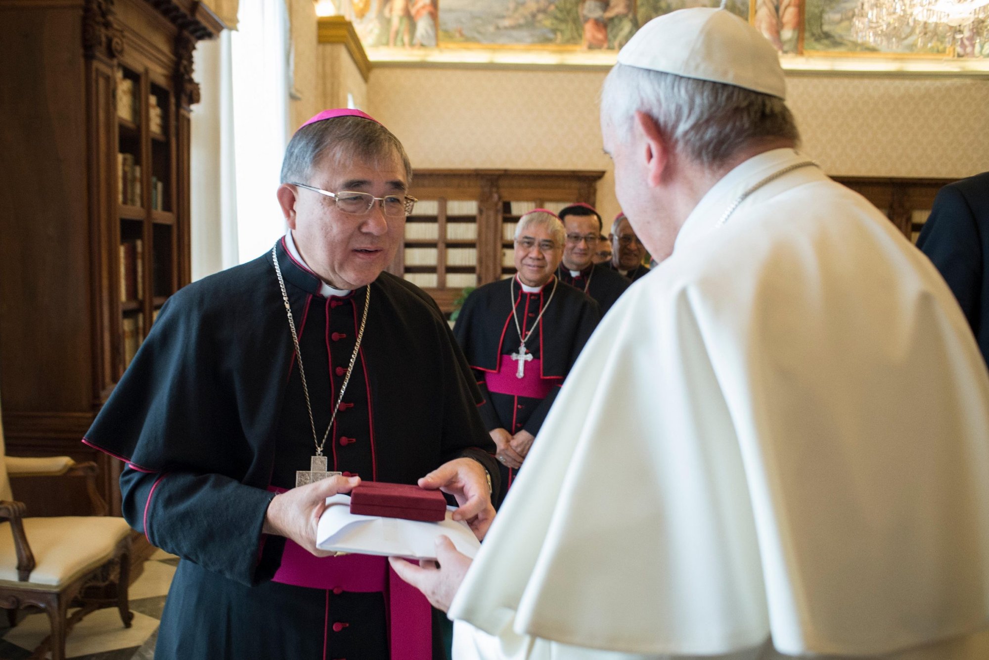 Pope Francis greets Bishop Cornelius Sim, apostolic vicar of Brunei, during his "ad limina" visit to the Vatican in this Feb. 8, 2018, file photo. Bishop Sim was among 13 new cardinals named by Pope Francis Oct. 25. (CNS photo/Vatican Media)