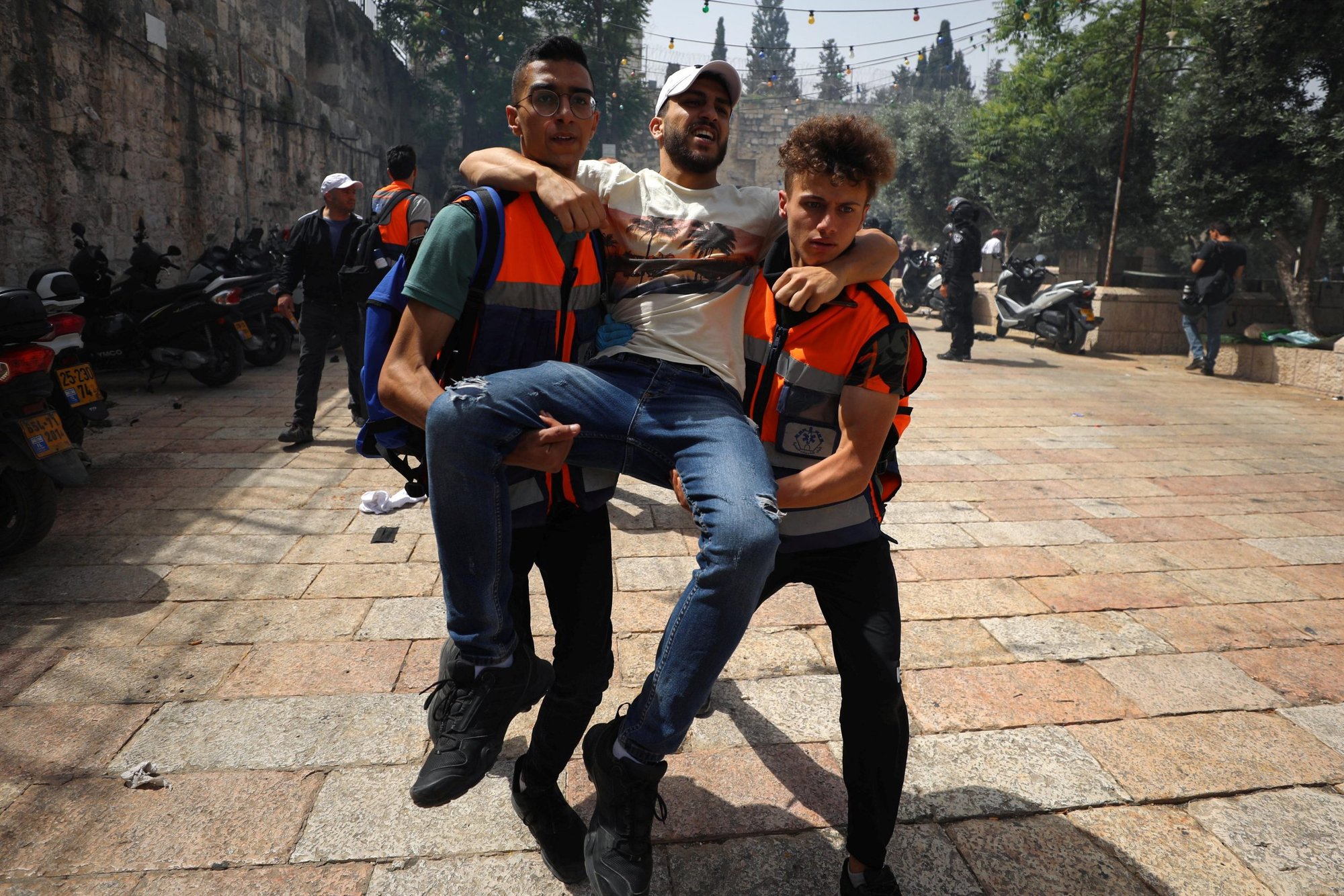 A wounded Palestinian protester is evacuated during clashes with Israeli police outside Al-Aqsa Mosque at the Temple Mount complex in the Old City of Jerusalem May 10, 2021. (CNS photo/Ammar Awad, Reuters)