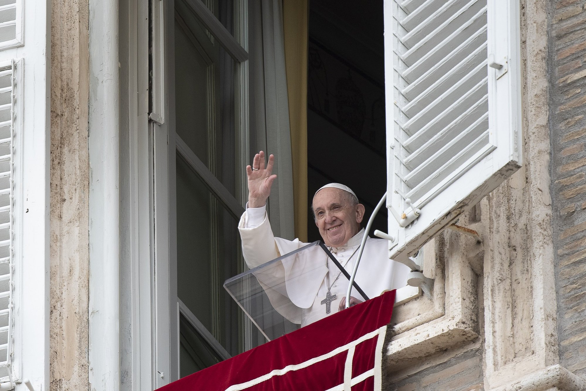 Pope Francis greets the crowd as he leads the "Regina Coeli" from the window of his studio overlooking St. Peter's Square at the Vatican May 17, 2021. The pope said the death and injury of so many innocent people in the Gaza-Israel clashes is "terrible and unacceptable." (CNS photo/Vatican Media)