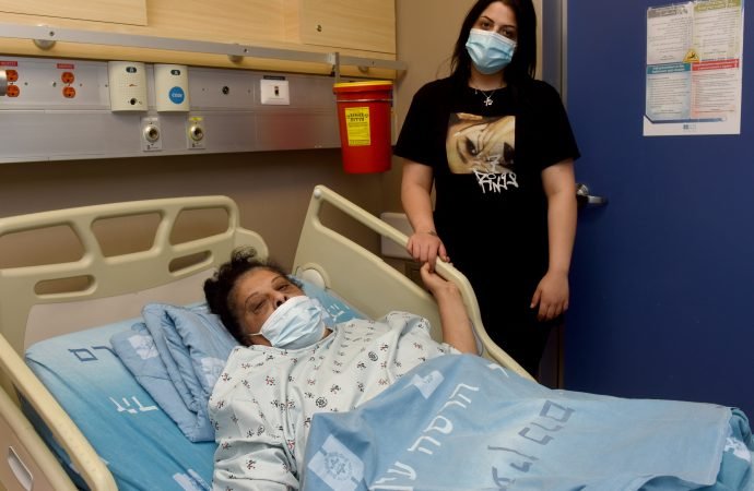 Arab Catholic Randa Aweis, 58, recovers from a kidney transplant with her daughter Niveen, 26, in Hadassah Medical Center in Jerusalem, May 21, 2021. Aweis received a donor kidney from an Israeli Jew, Yigal Yehoshua, 56, who died after being hit with stones during riots in Lod, Israel. (Debbie Hill/CNS)