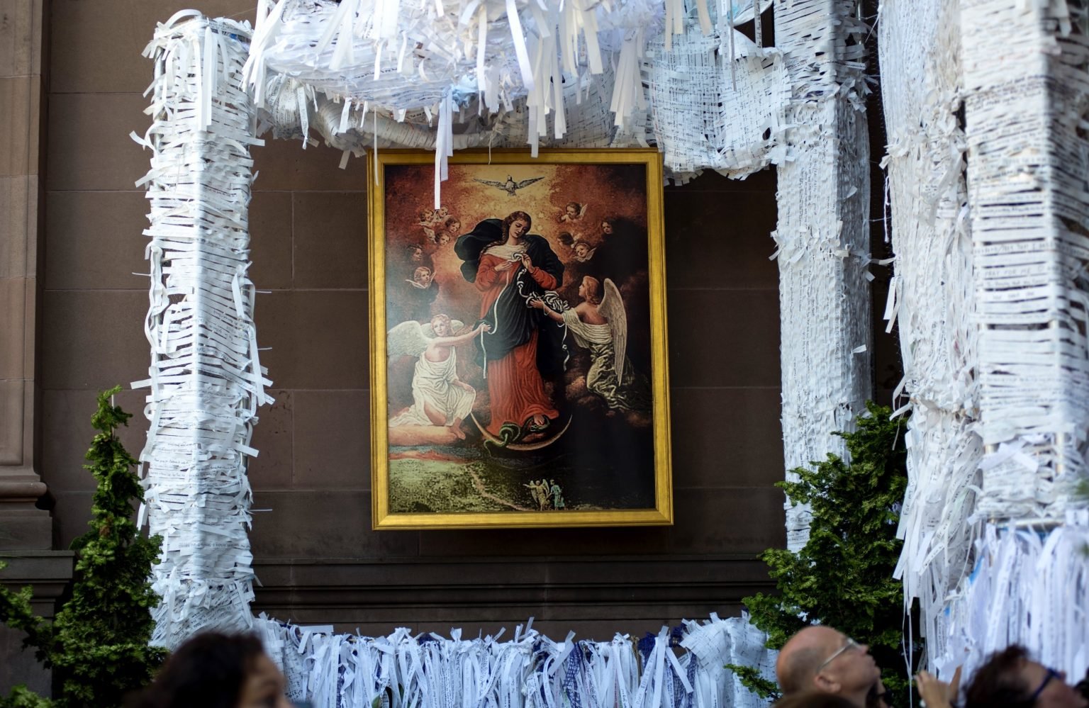 A painting of Mary Undoer of Knots hangs within the Knotted Grotto at the Cathedral Basilica of SS. Peter and Paul in Philadelphia during the World Meeting of Families in this September 2015 file photo. On May 31, 2021, Pope Francis will conclude the Catholic Church's monthlong rosary marathon with special prayers to Mary Undoer of Knots, one of his favorite titles for the mother of Jesus. (Carley Mossbrook/CNS)