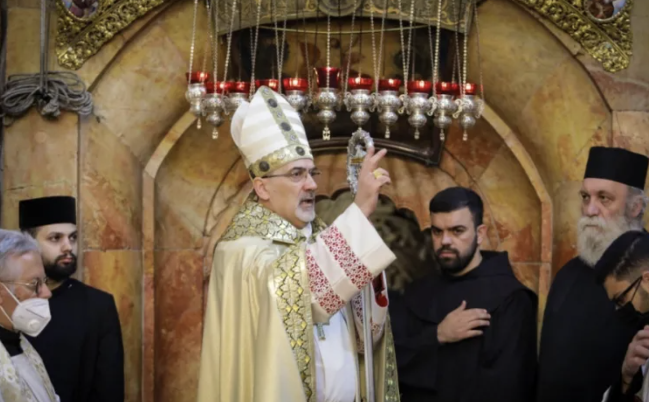 Patriarch Pierbattista Pizzaballa blesses the congregation at the Church of the Holy Sepulchre in Jerusalem on April 4, 2021. (Latin Patriarchate of Jerusalem)